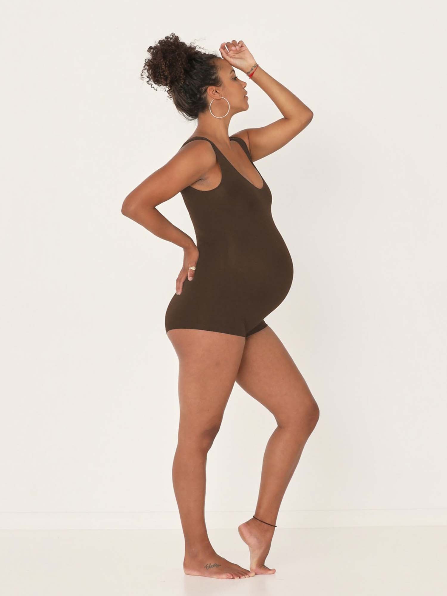 Model wearing a reversible cocoa brown boyleg bodysuit with scoop and boat necklines, women's bamboo clothing