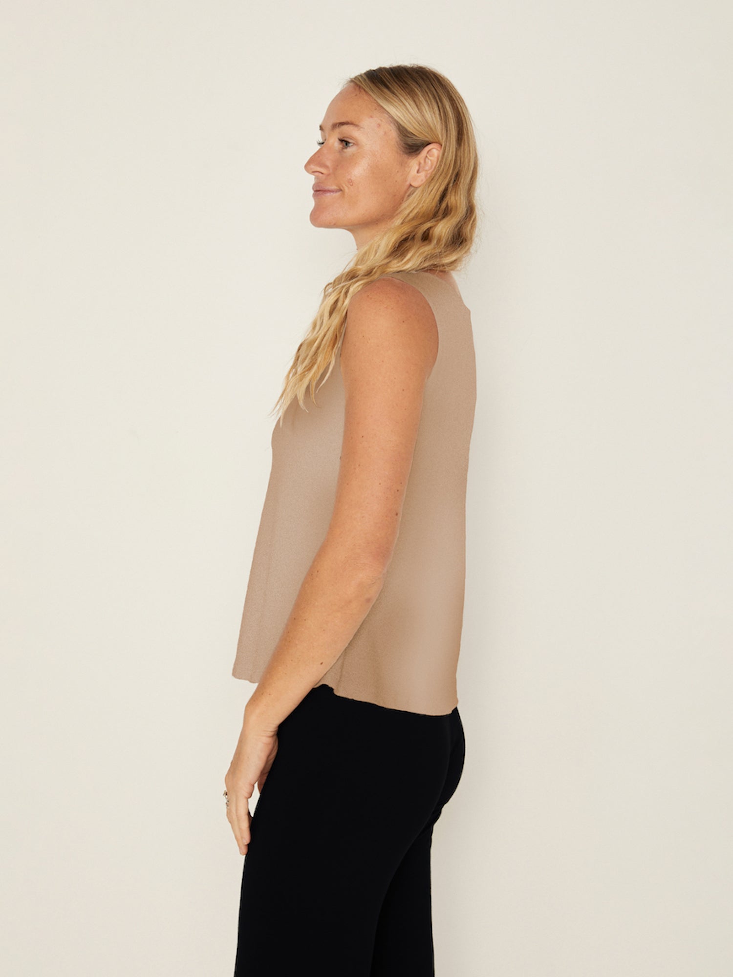 Model wearing a caramel brown coloured boat neck singlet with wide shoulder coverage, women's bamboo clothing