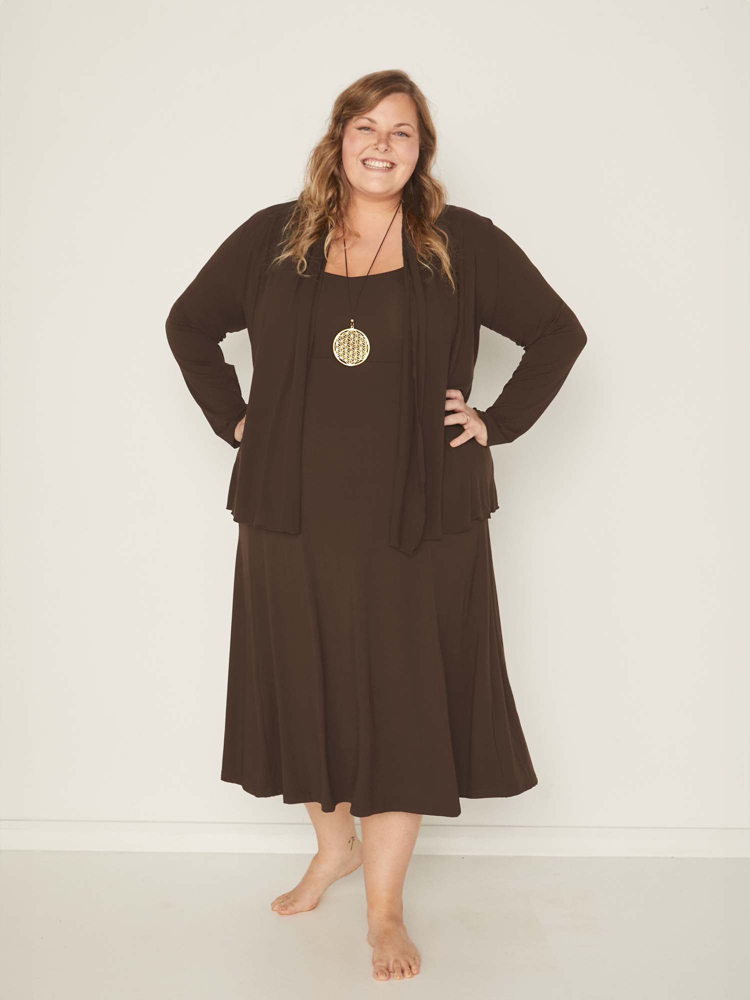 Model wearing a cocoa brown mid length swing style dress with a sweetheart neckline,women's bamboo clothing