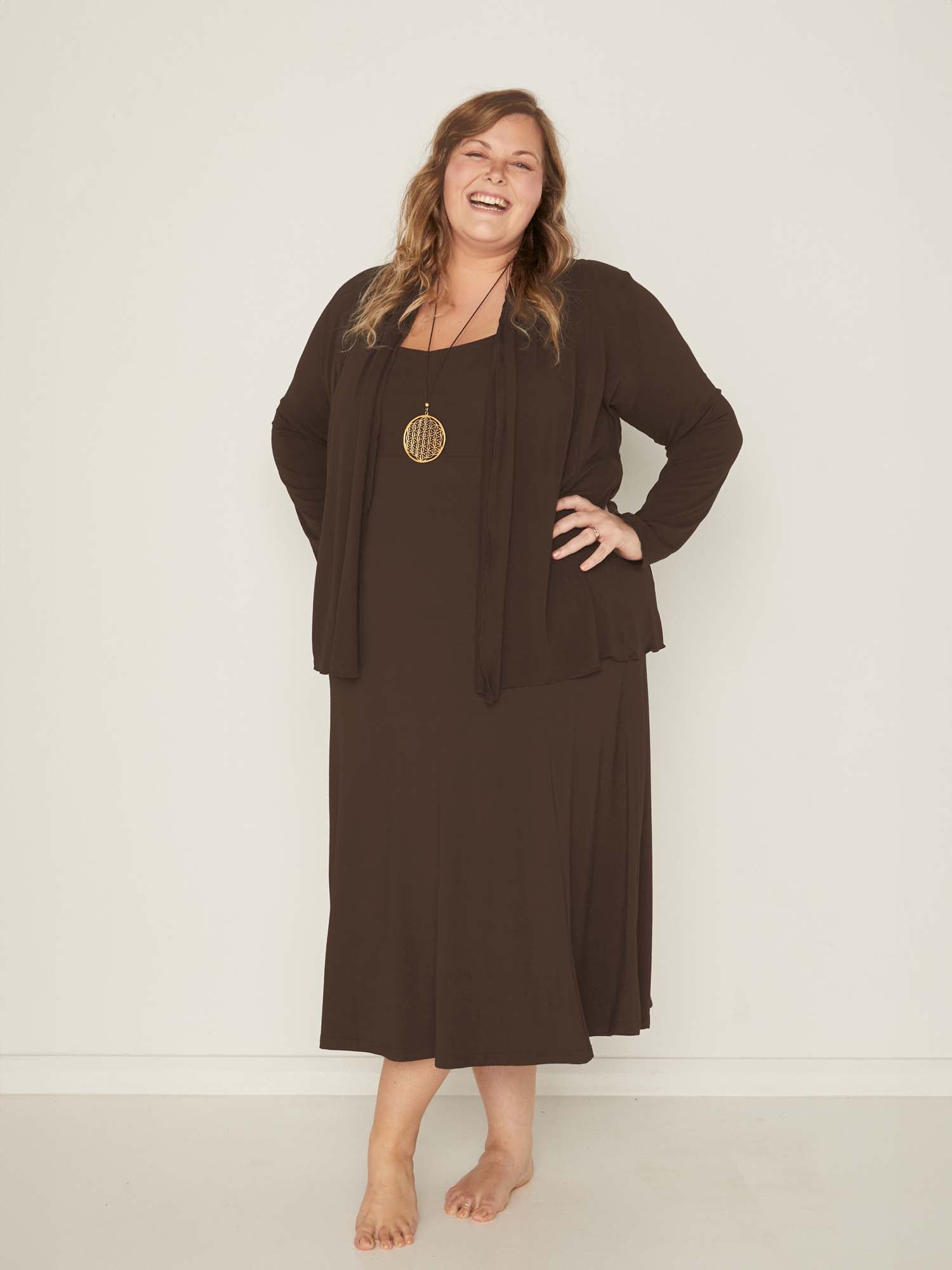 Model wearing a cocoa brown mid length swing style dress with a sweetheart neckline,women's bamboo clothing
