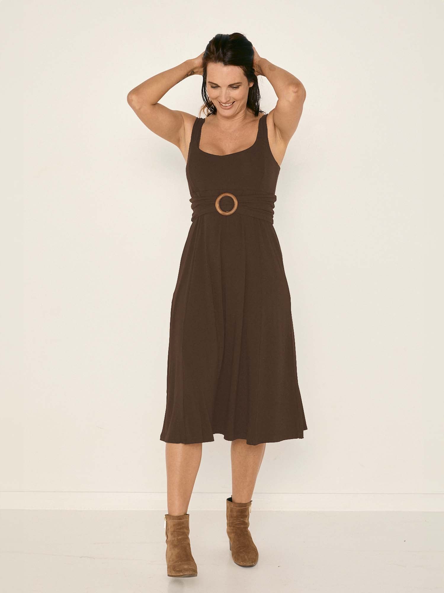 Model wearing a cocoa brown mid length swing style dress with a sweetheart neckline,women's bamboo clothing