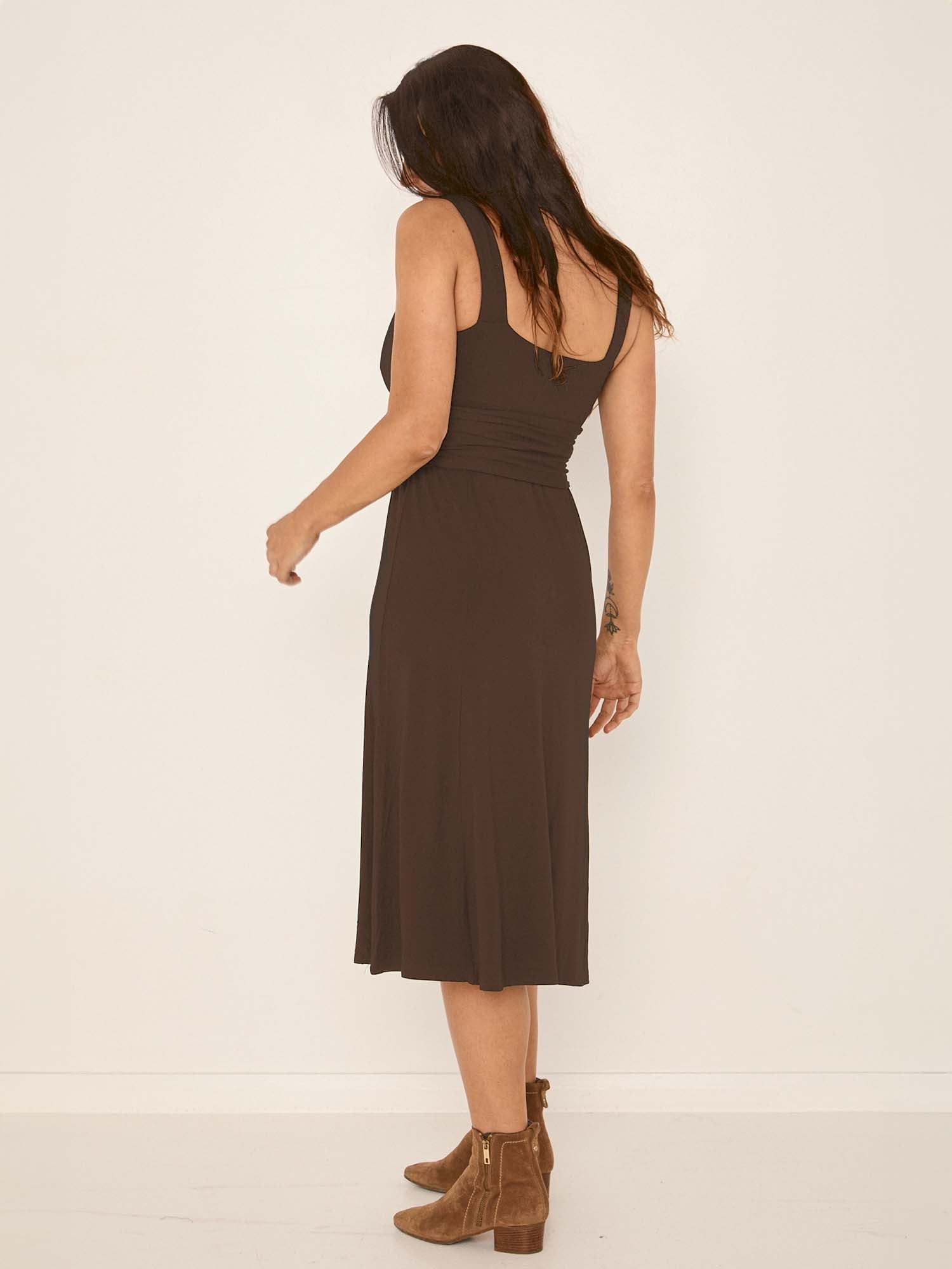 Model wearing a cocoa brown mid length swing style dress with a sweetheart neckline,women's bamboo clothing