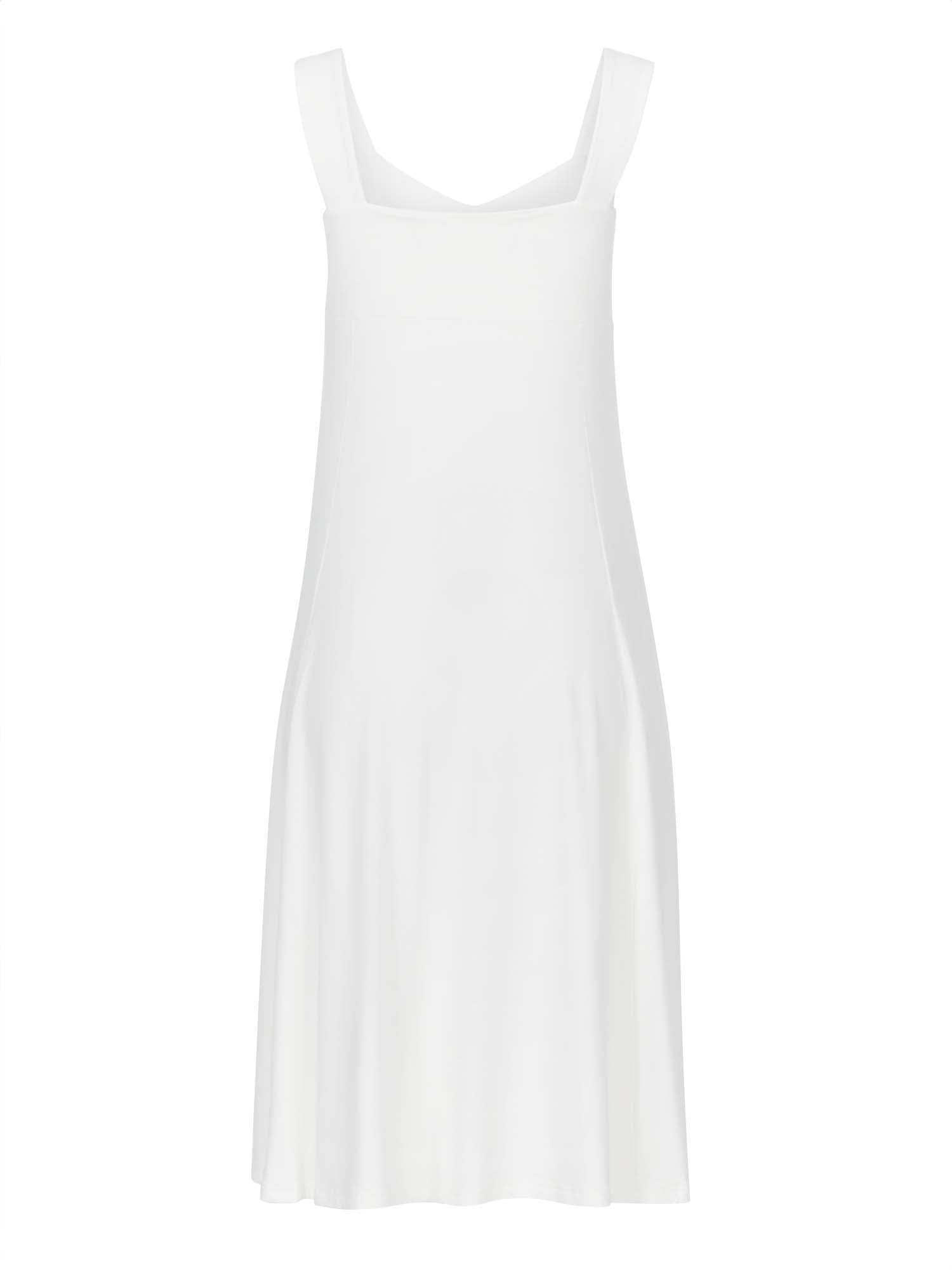 Model wearing a cream mid length, sweetheart neckline swing style dress, women's bamboo clothing