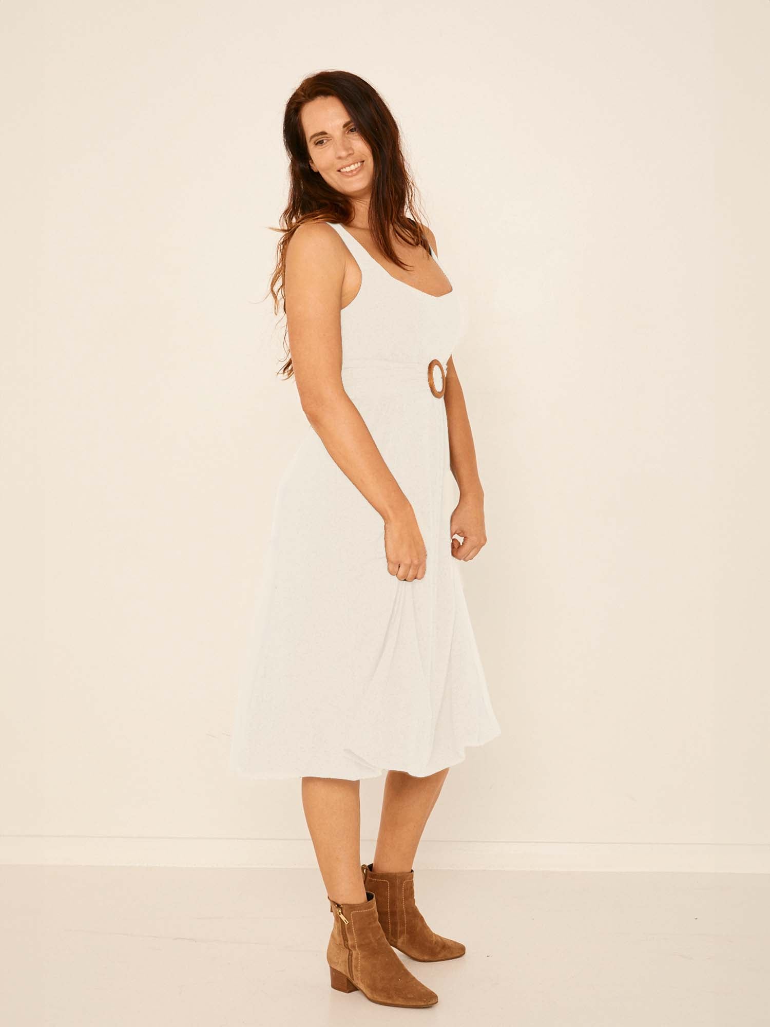 Model wearing a cream mid length, sweetheart neckline swing style dress, women's bamboo clothing