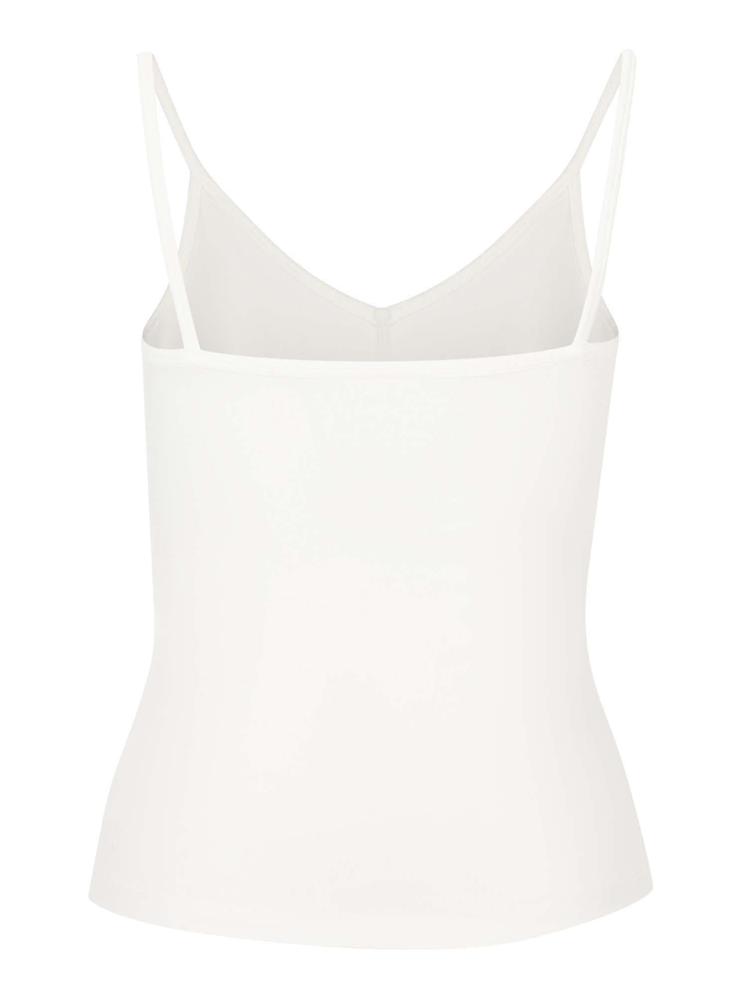 Model wearing a cream layering singlet with camisole straps, v neckline and fitted body, women's bamboo clothing