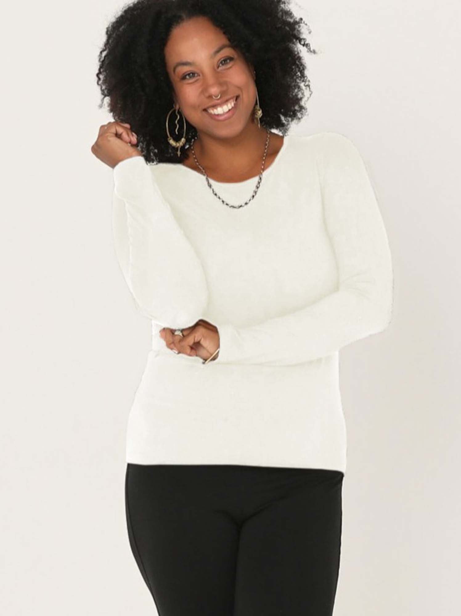 Model wearing a reversible cream fitted body long sleeve t-shirt with crew and boat necklines, women's bamboo clothing