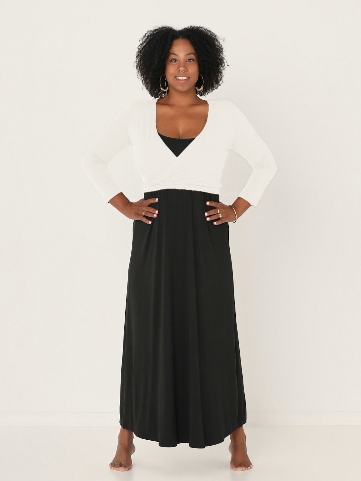 Model wearing a cream ballet wrap cardigan with plunge neckline and fitted 3/4 sleeves, women's bamboo clothing