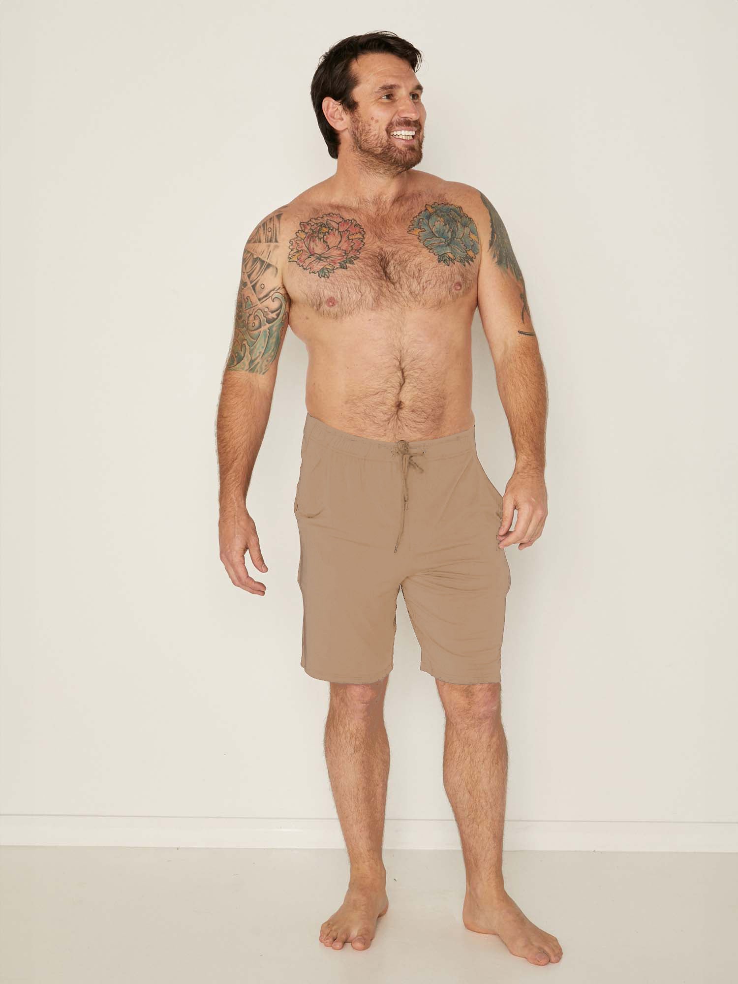 Male model wears Bamboo Casual Shorts in Caramel