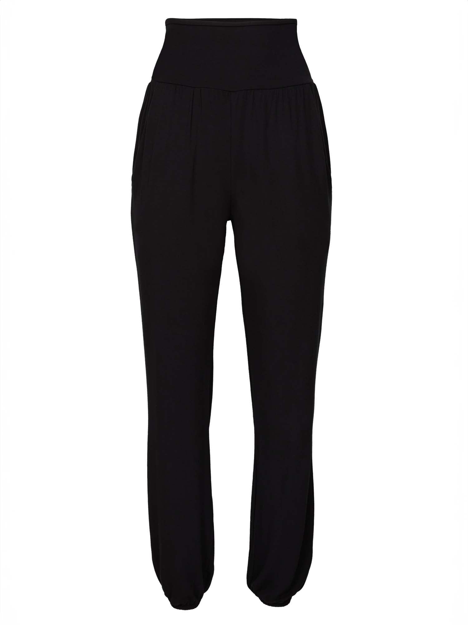 Model wearing black lounge pants with a deep waistband, long relaxed leg, elasticised cuff and side pockets, women's bamboo clothing