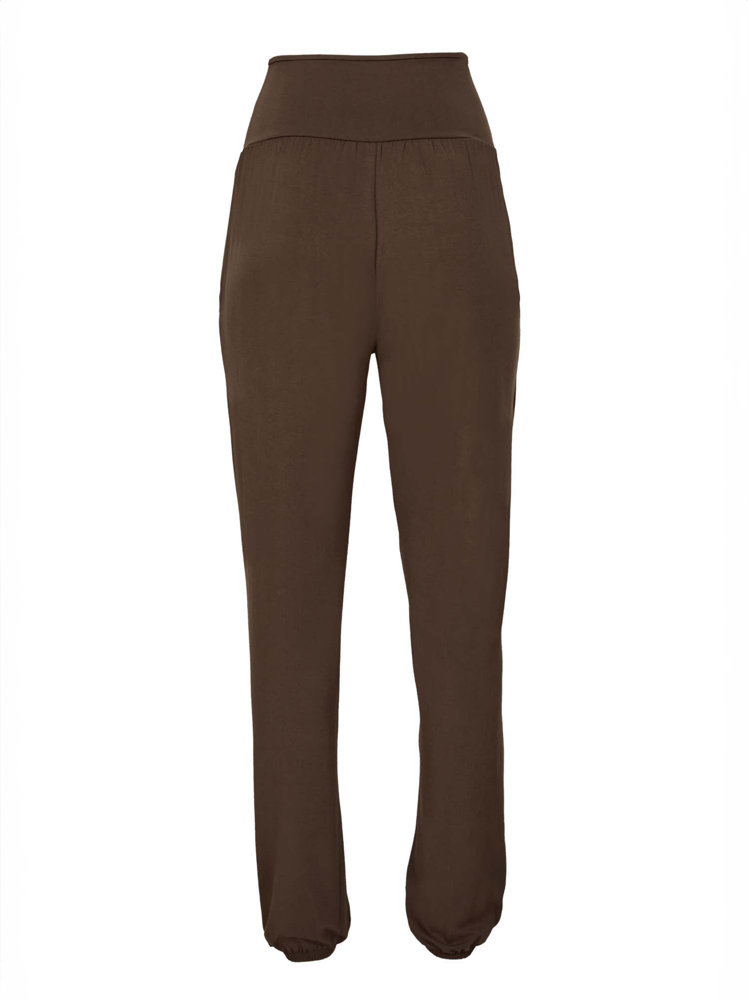 Model wearing cocoa brown lounge pants with a deep waistband, long relaxed leg, elasticised cuff and side pockets, women's bamboo clothing