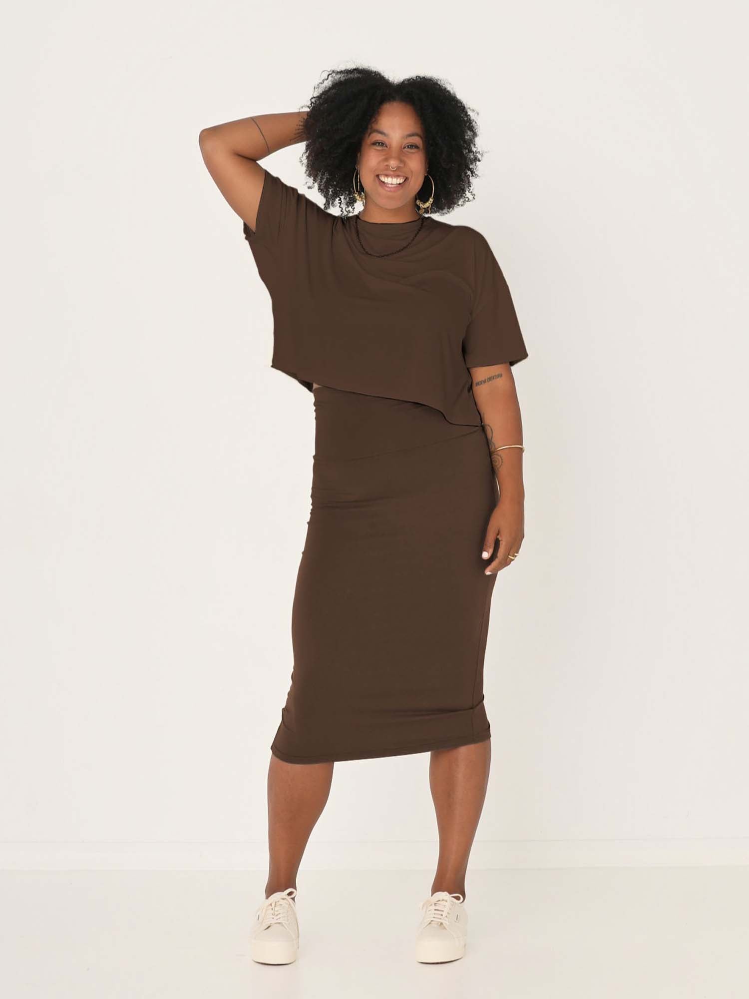 Model wearing cocoa brown midi pencil tube skirt, mid calf length with a deep waistband, women's bamboo clothing