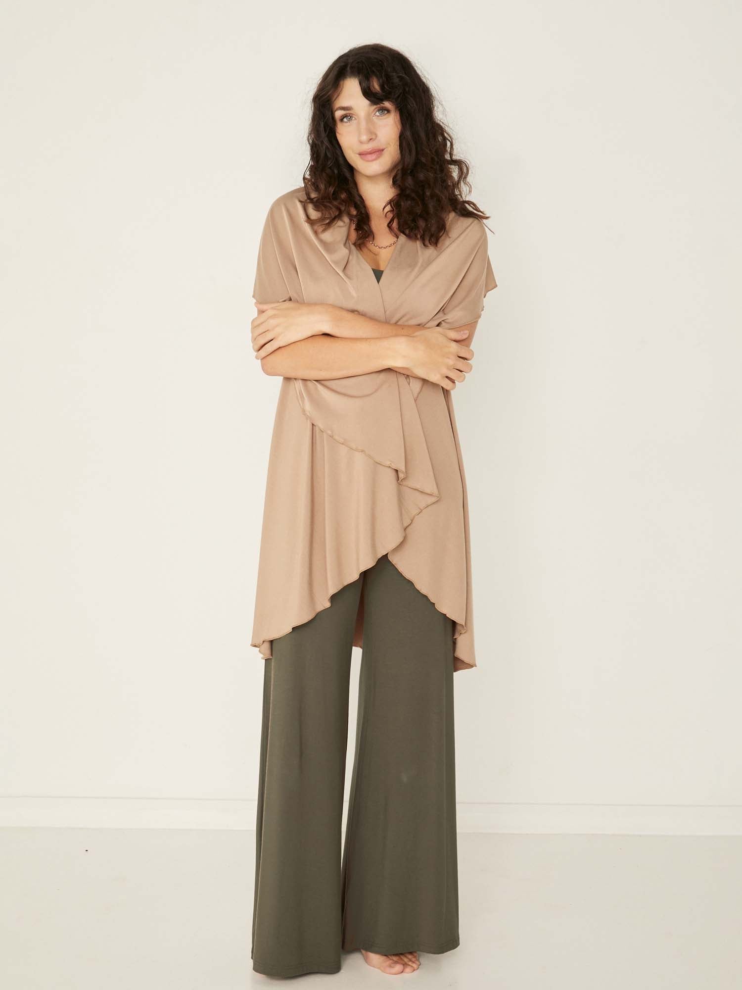 Model wearing a caramel brown convertible style goddess wrap; long cardi, vest or poncho, women's bamboo clothing
