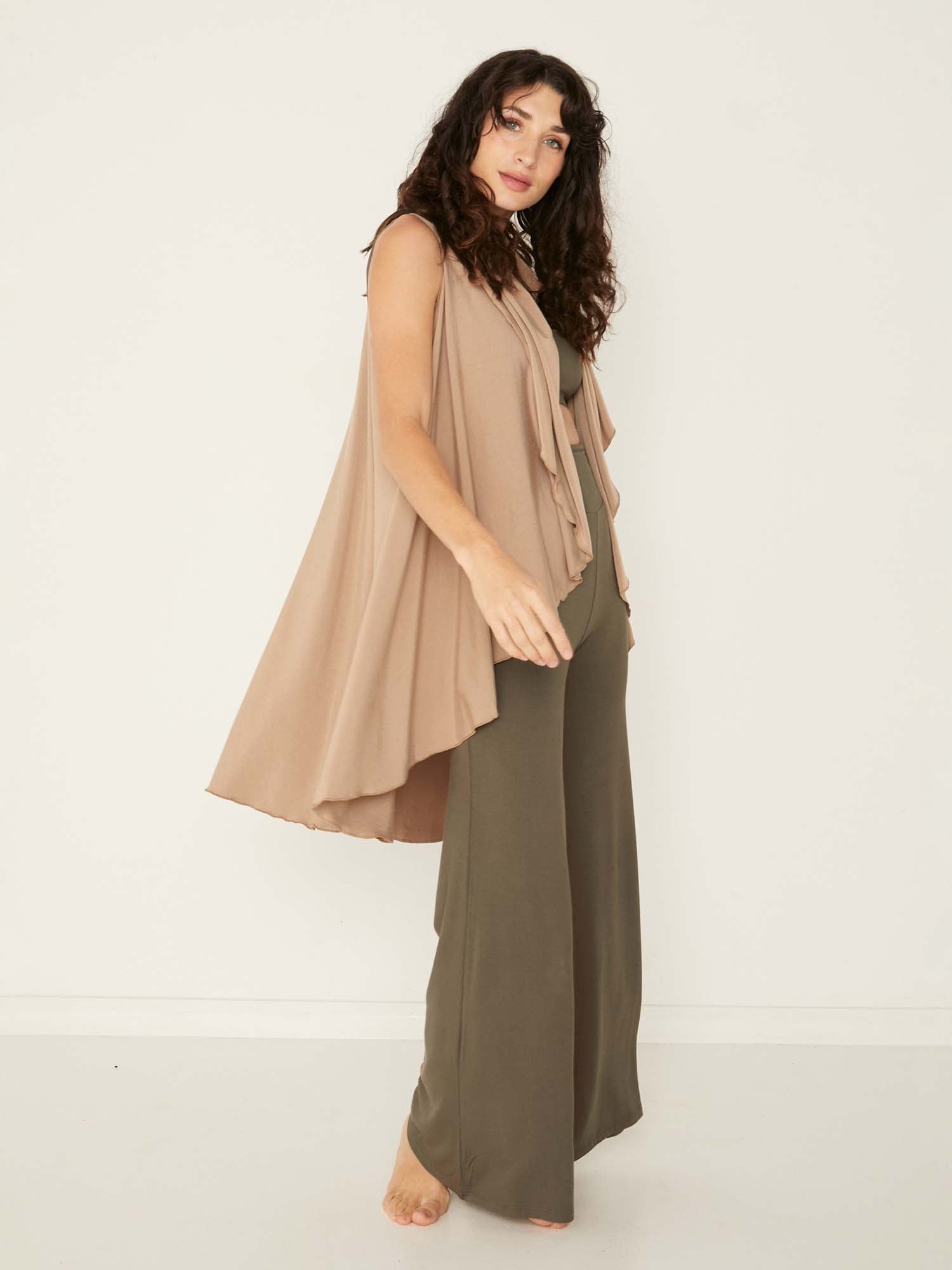 Model wearing a caramel brown convertible style goddess wrap; long cardi, vest or poncho, women's bamboo clothing