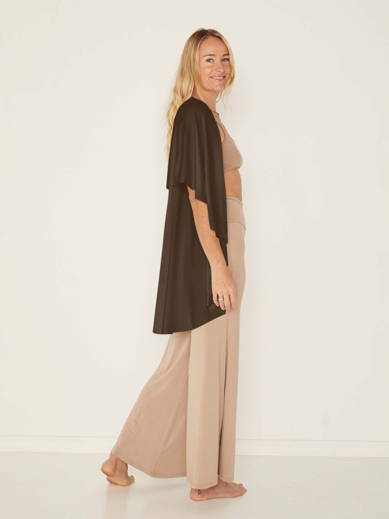 Model wearing a cocoa brown convertible style goddess wrap; long cardi, vest or poncho, women's bamboo clothing
