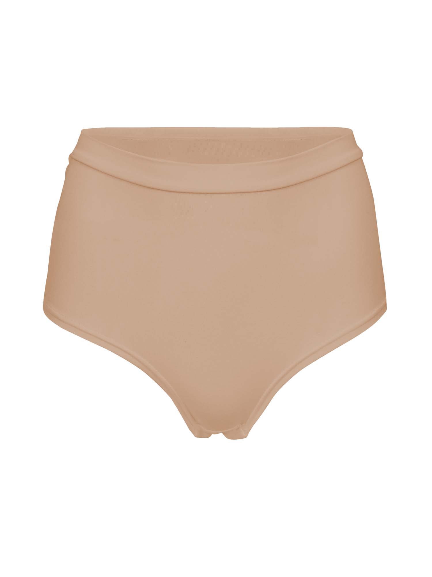 Model wearing caramel high waisted full brief with mid leg opening and double layered waistband, women's bamboo underwear