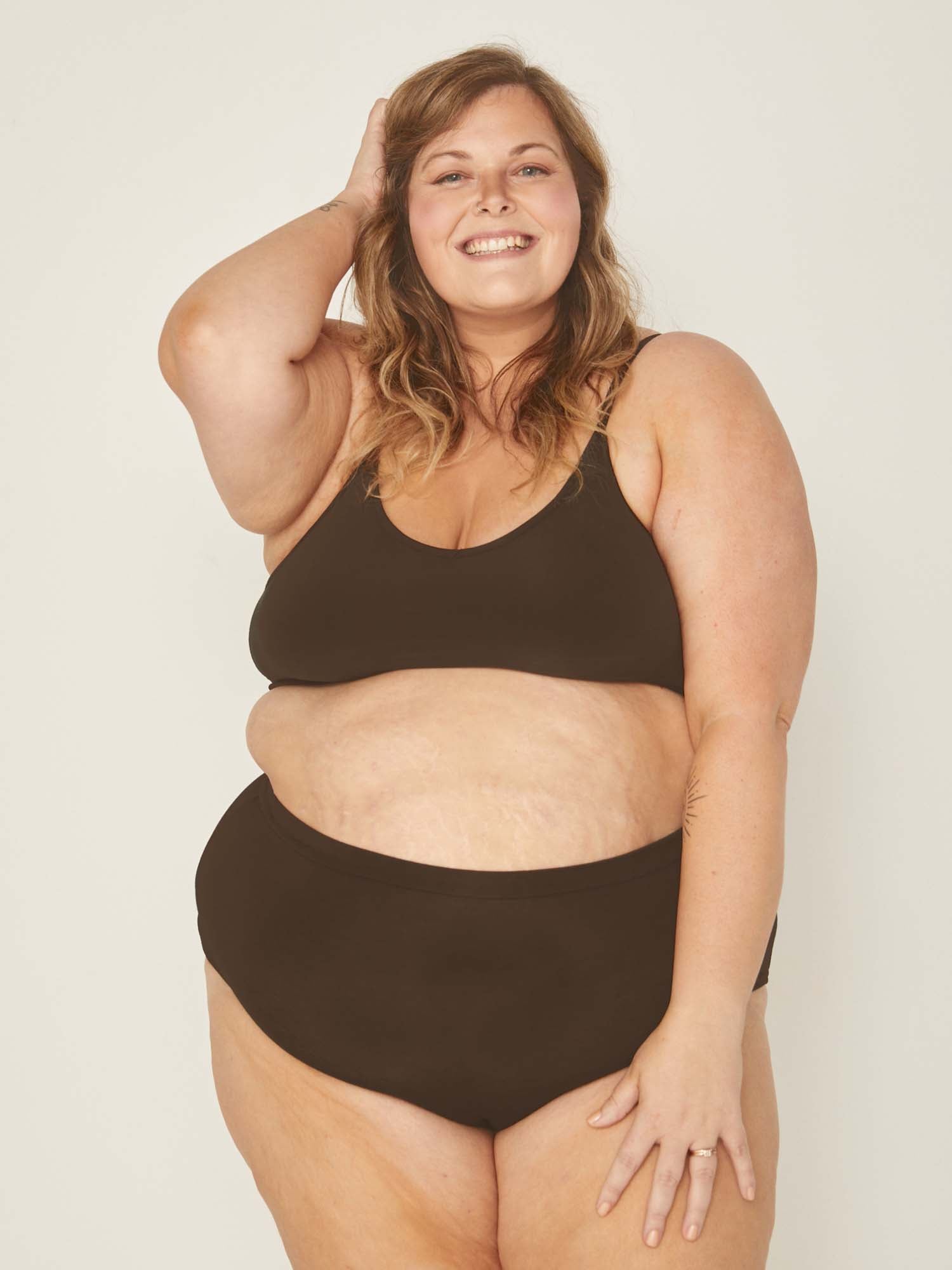 Model wearing cocoa brown high waisted full brief with mid leg opening and double layered waistband, women's bamboo underwear