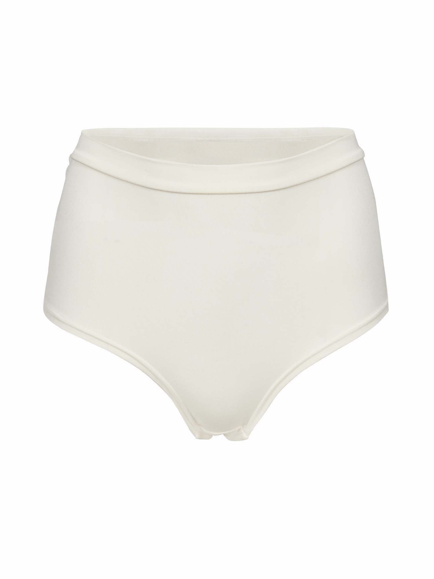 Model wearing cream high waisted full brief with mid leg opening and double layered waistband, women's bamboo underwear