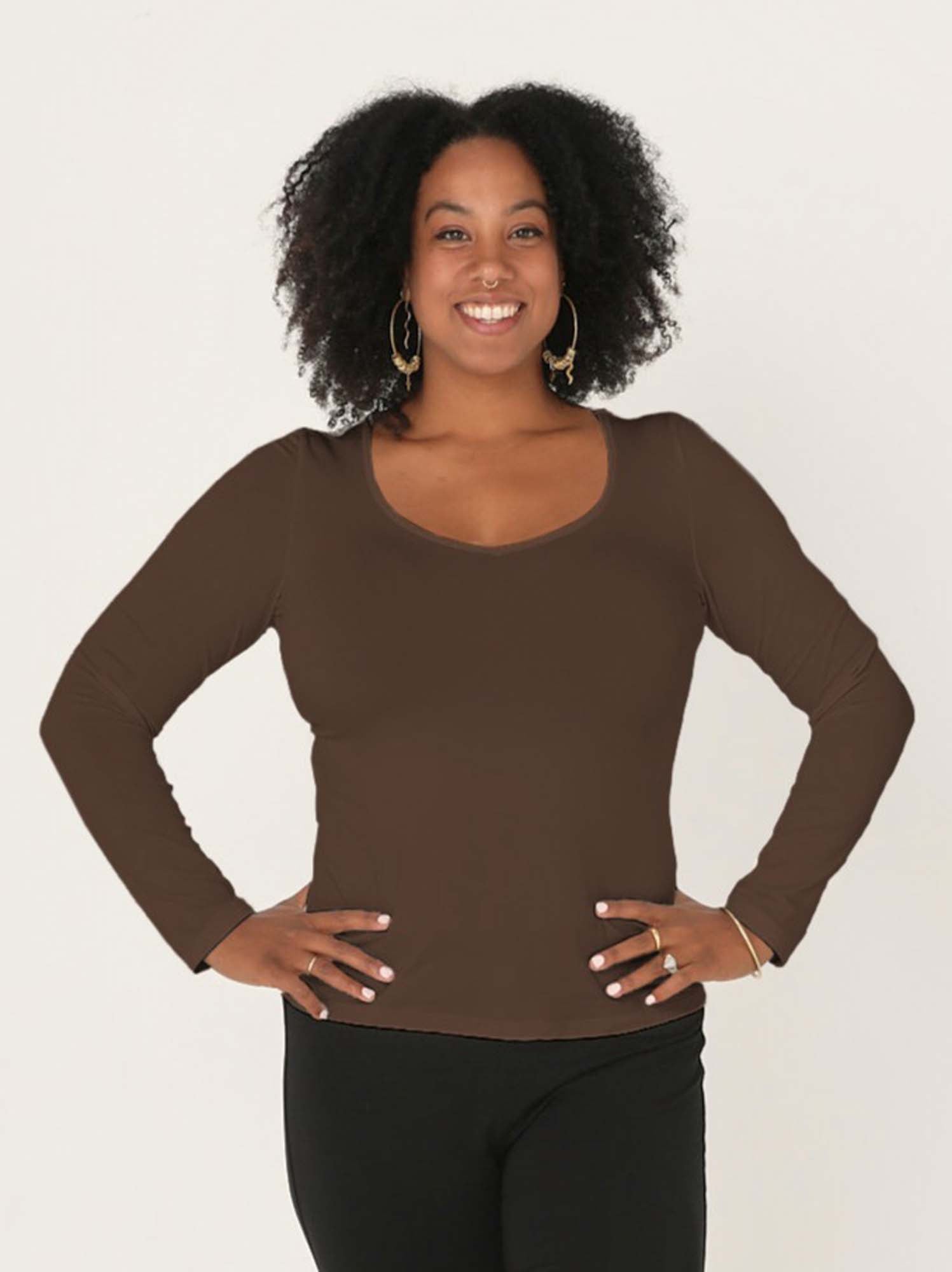 Model wearing a reversible cocoa brown fitted body, long sleeve t-shirt with v and boat necklines, women's bamboo clothing