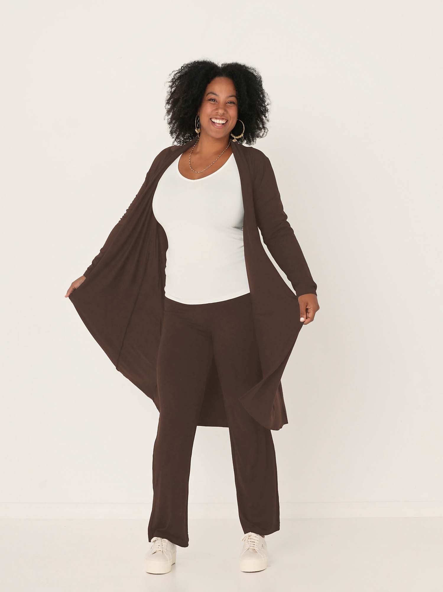 Model wearing cocoa brown long cardigan, below knee length jacket with long fitted sleeves, women's bamboo clothing