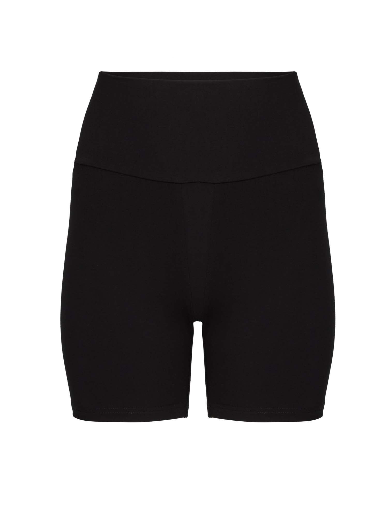 Model wearing black mid thigh length sporty shorts with adjustable high waistband, women's bamboo clothing