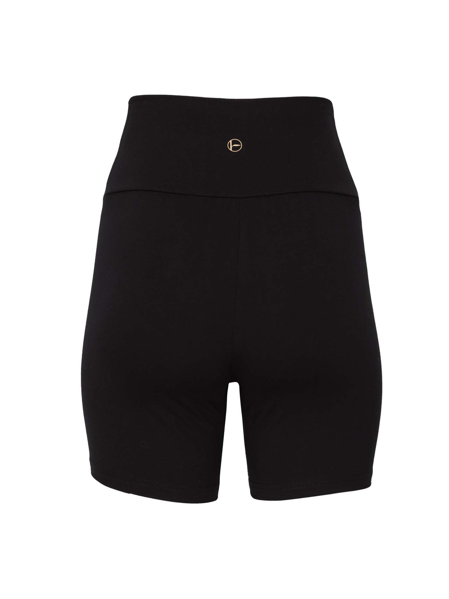 Model wearing black mid thigh length sporty shorts with adjustable high waistband, women's bamboo clothing