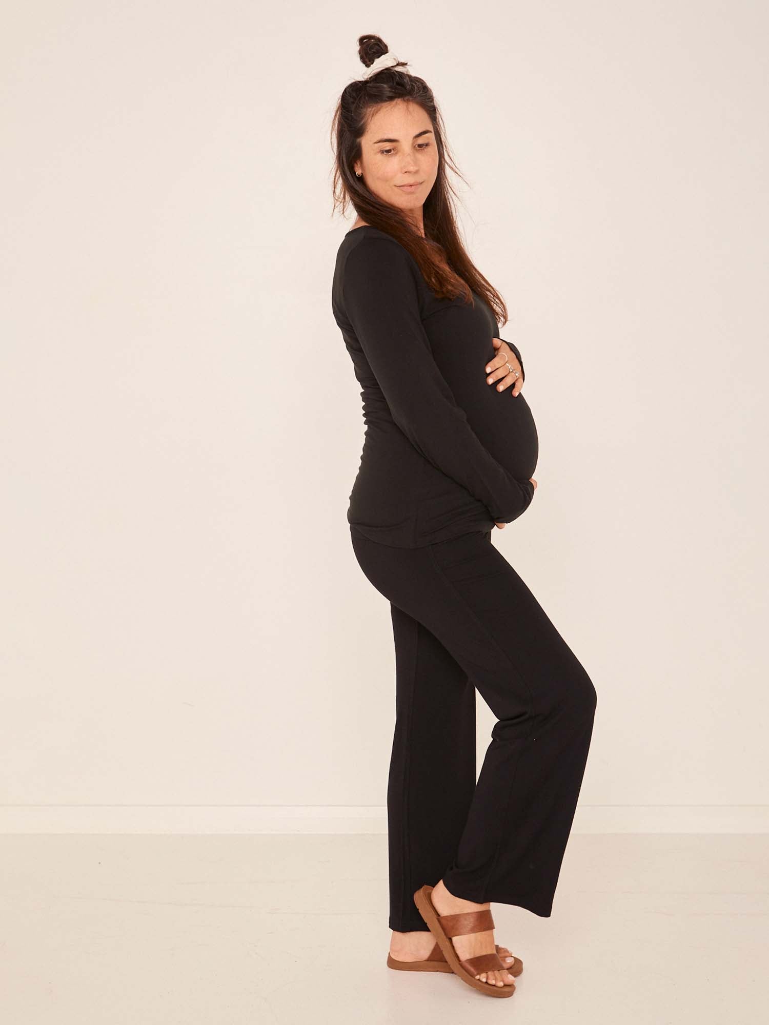 Model wearing black full length straight leg pants, double layered adjustible/high waistband, classic cut, women's bamboo clothing