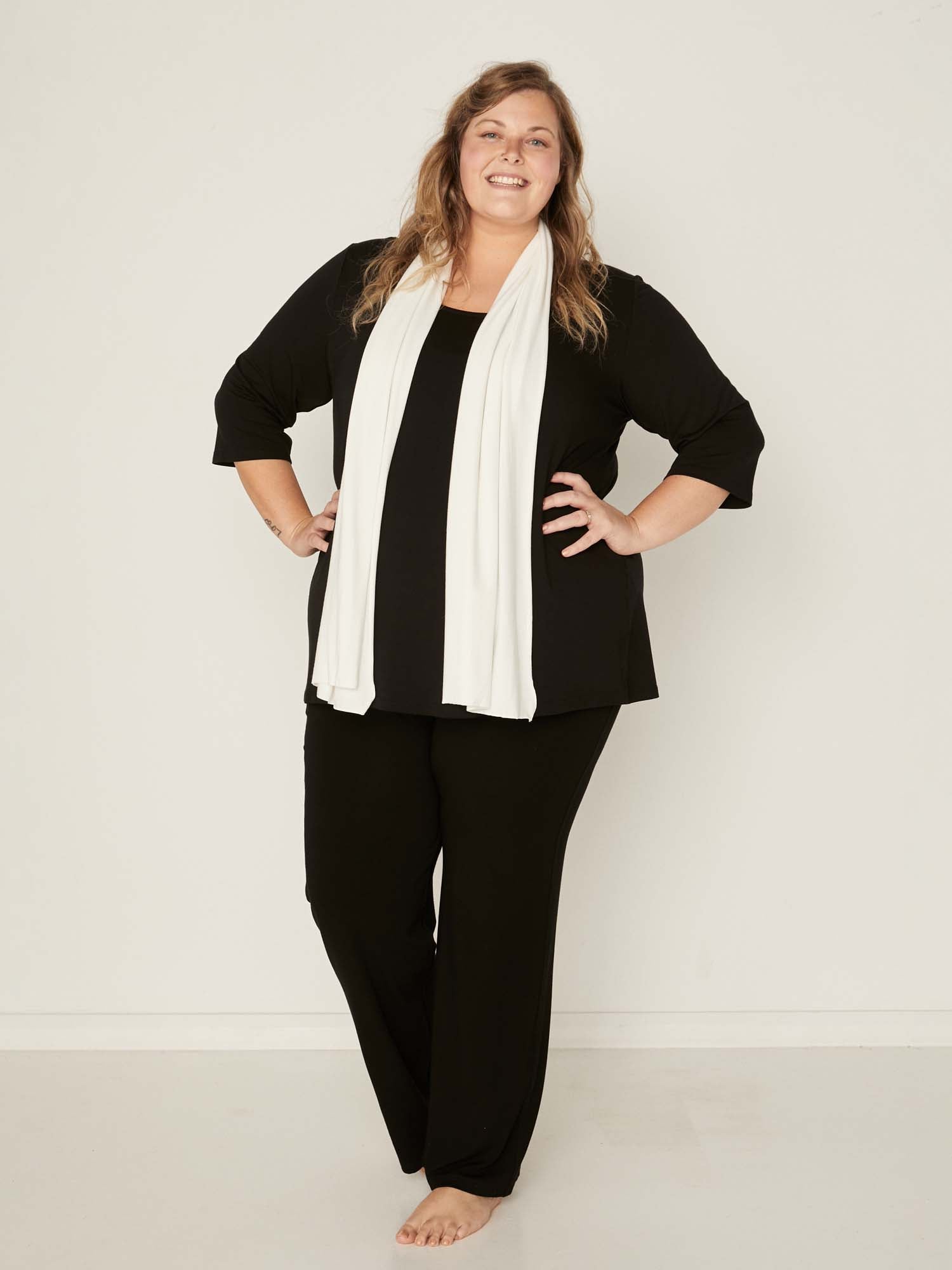 Model wearing black full length straight leg pants, double layered adjustible/high waistband, classic cut, women's bamboo clothing