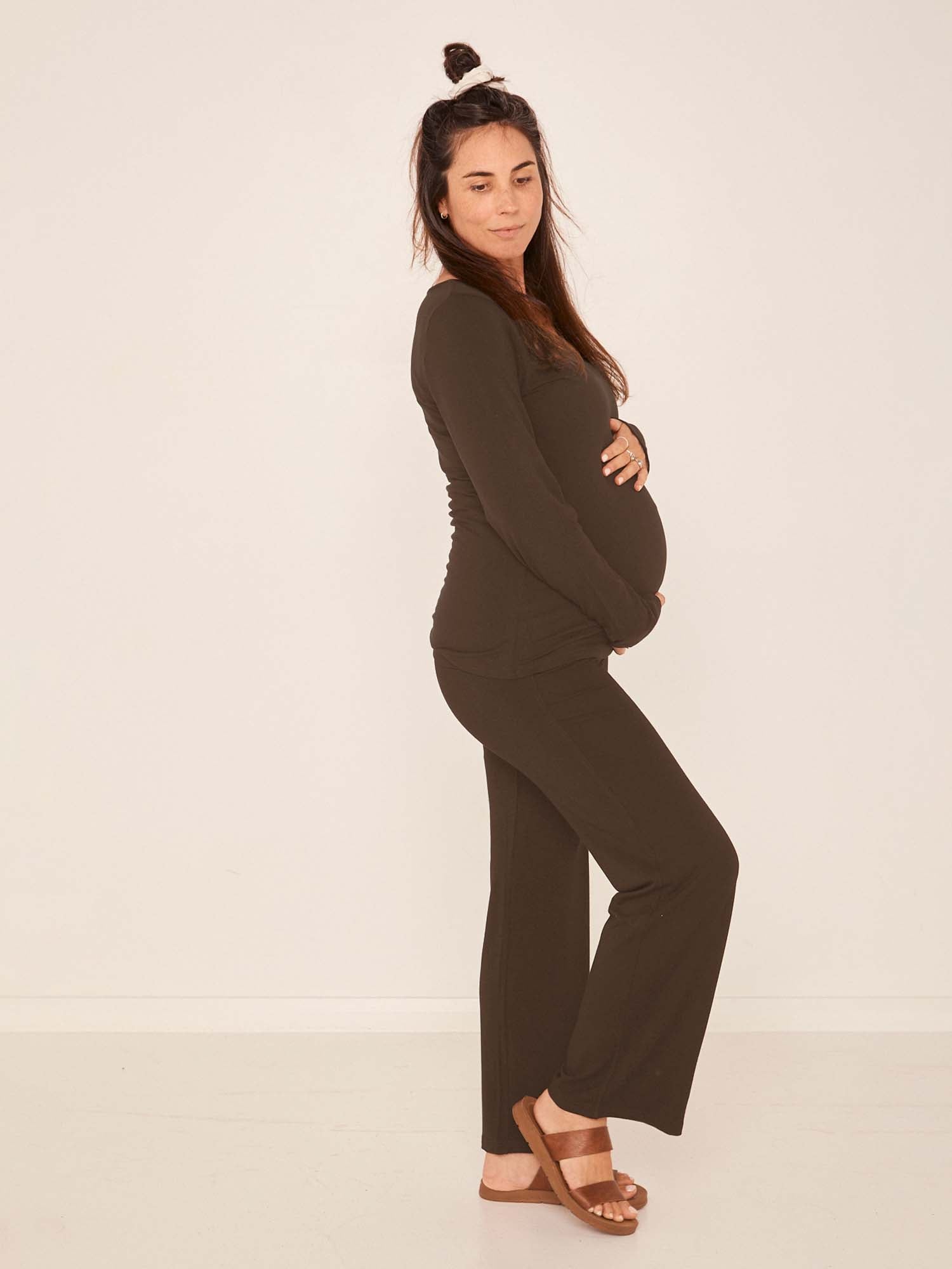 Model wearing cocoa brown full length straight leg pants, double layered adjustable/high waistband, classic cut, women's bamboo clothing