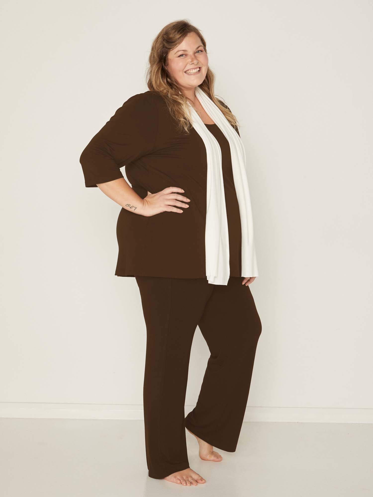 Model wearing cocoa brown full length straight leg pants, double layered adjustable/high waistband, classic cut, women's bamboo clothing