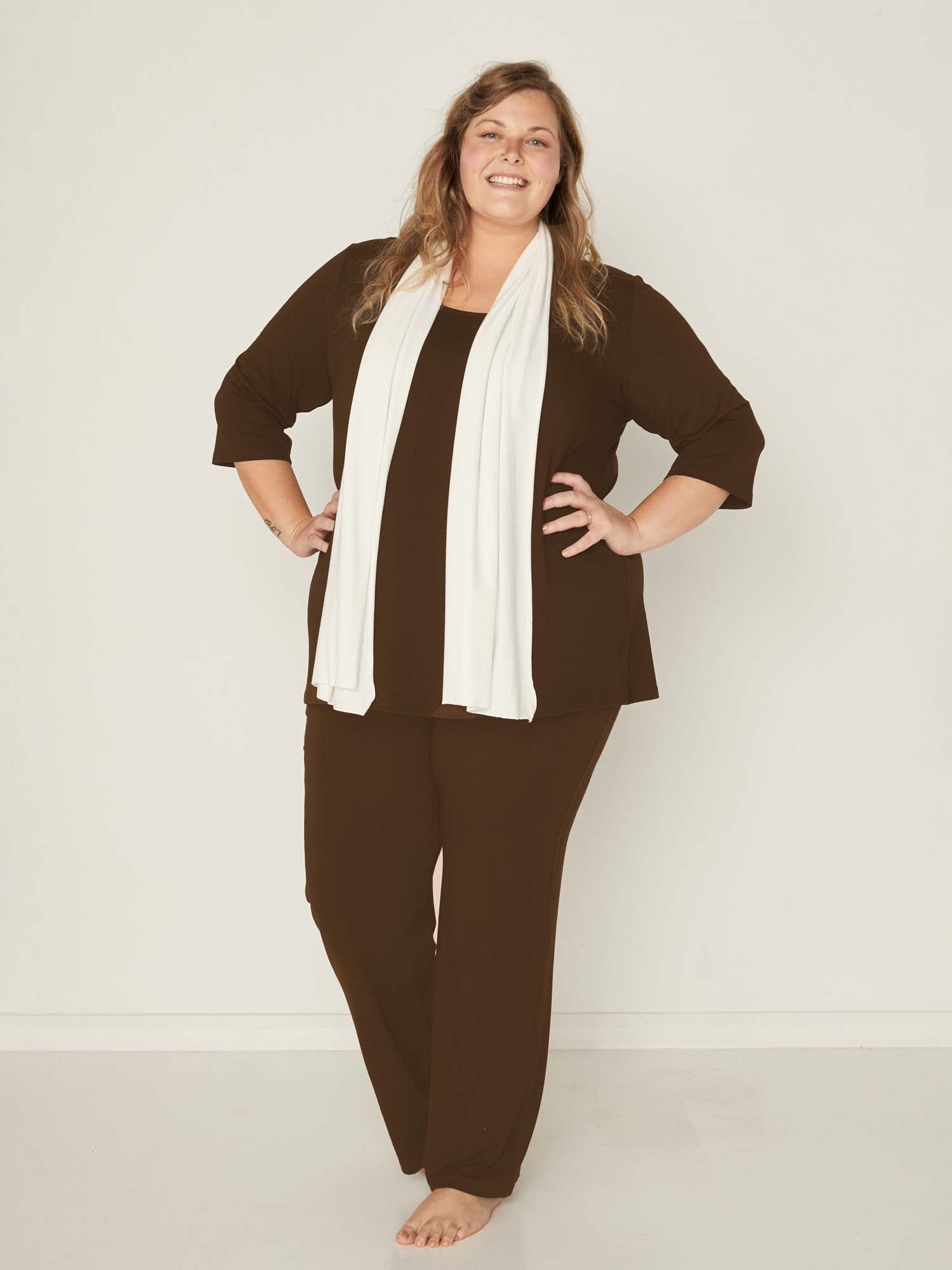 Model wearing cocoa brown full length straight leg pants, double layered adjustable/high waistband, classic cut, women's bamboo clothing