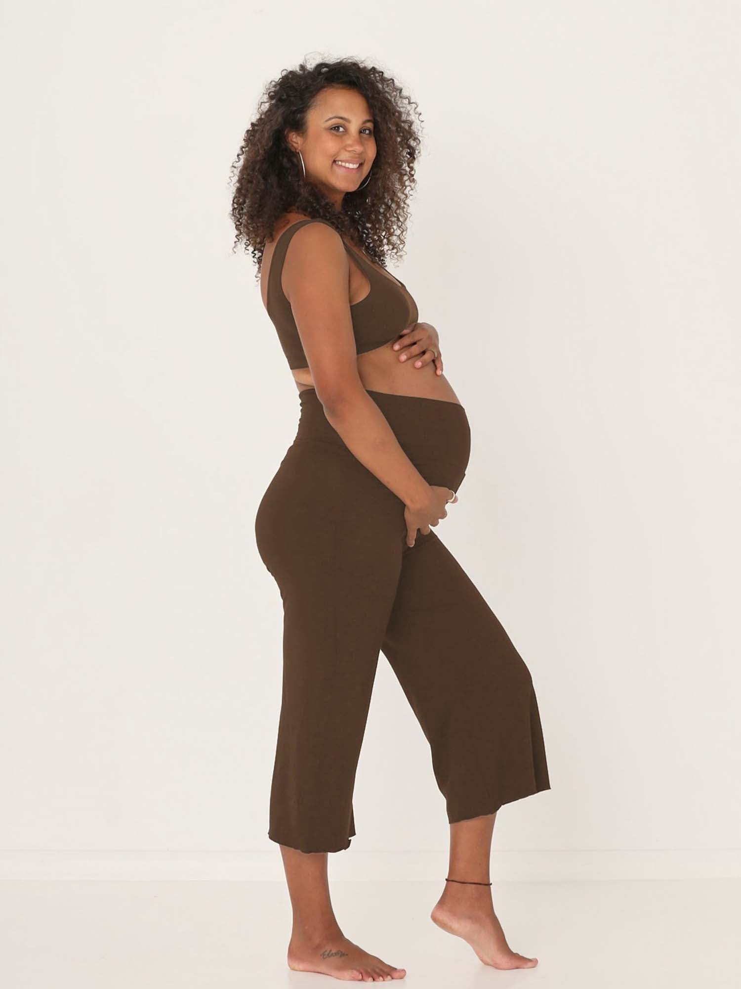 Model wearing cocoa brown 7/8 length resort pants, double layered adjustible high waistband, classic design, women's bamboo clothing