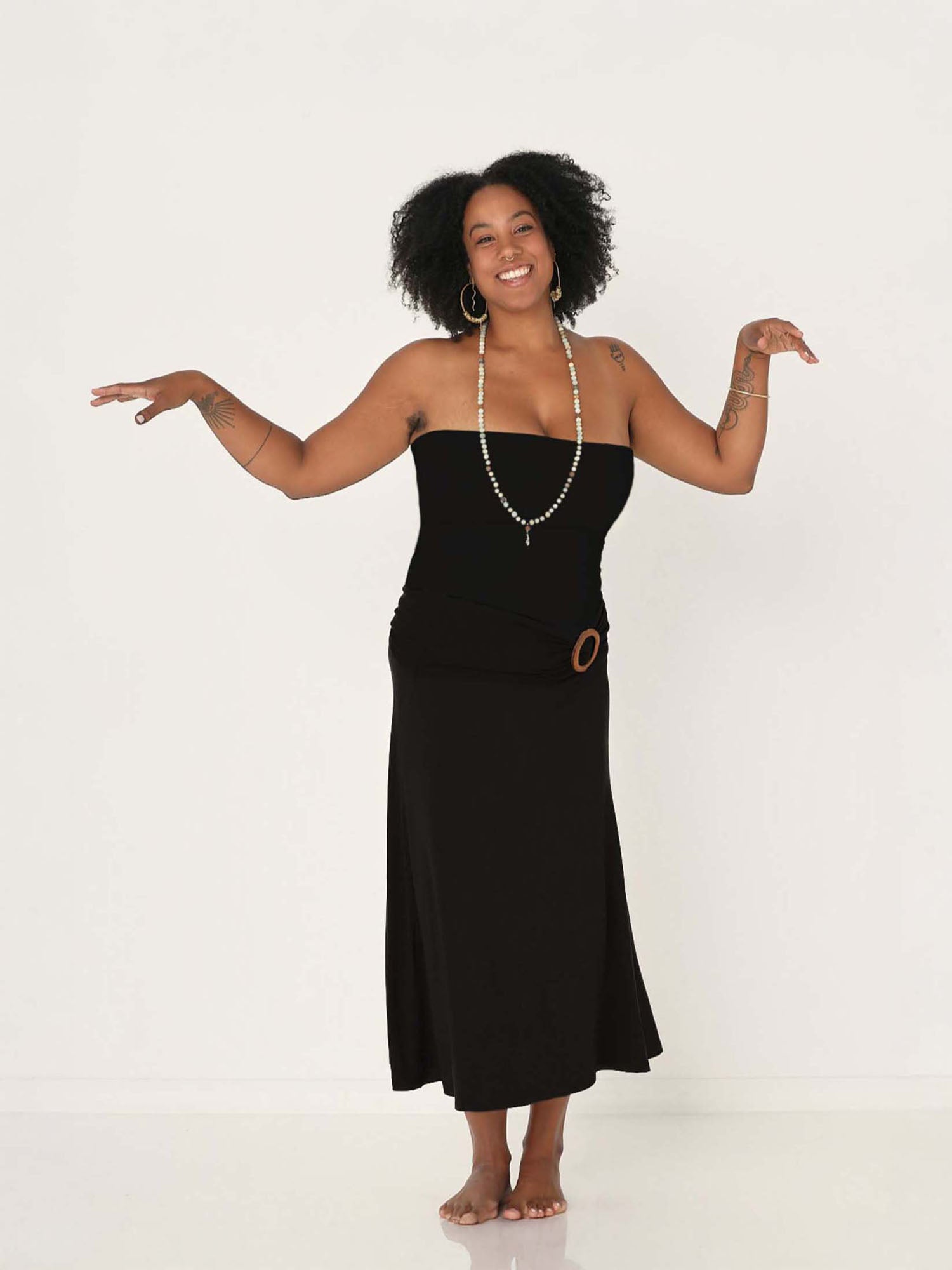 Model wearing black strapless boob tube top with supportive double layer fabric, women's bamboo clothing