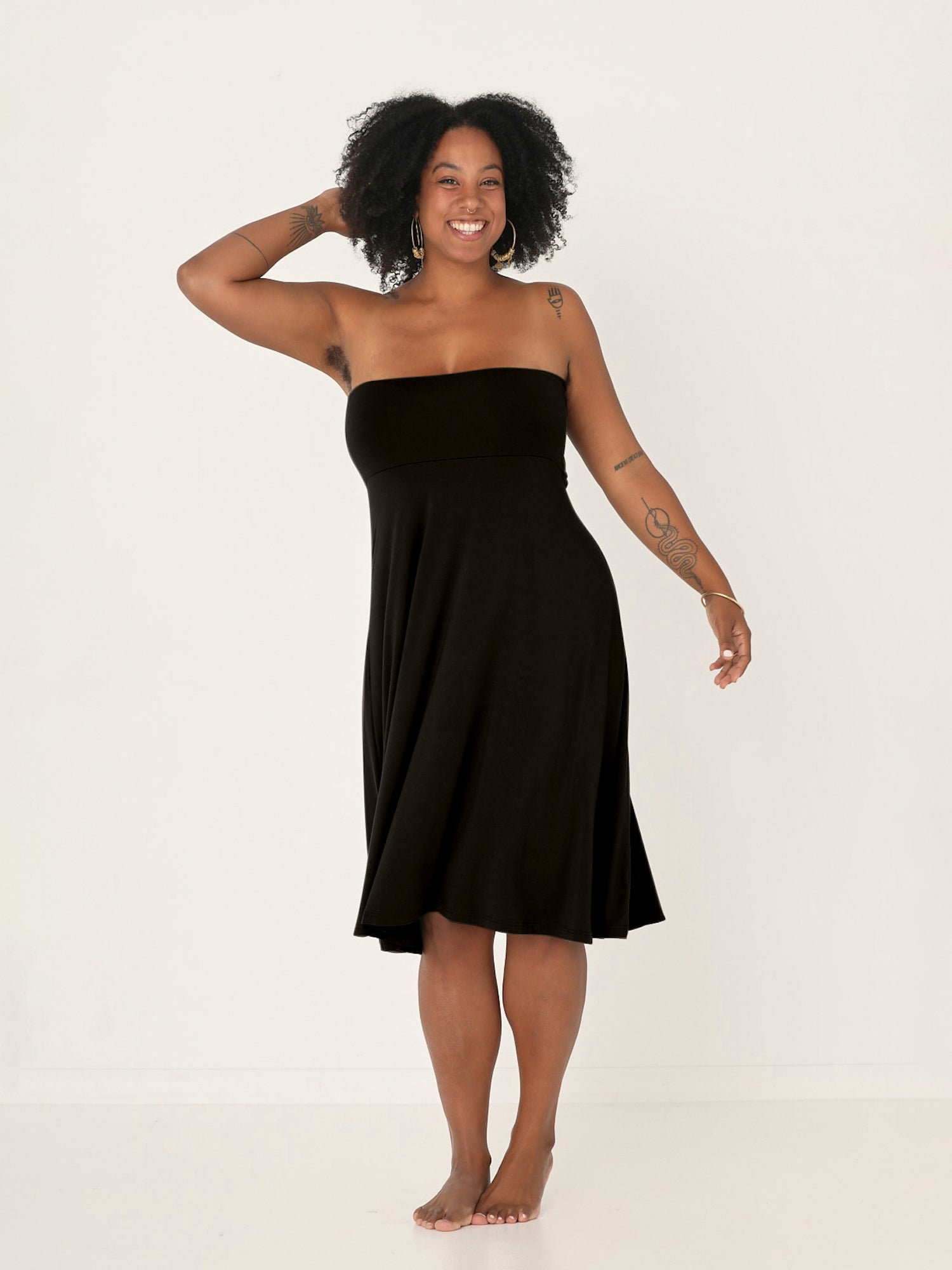 Model wearing black swing style long swishy skirt, mid - low calf length, double layered deep waistband, women's bamboo clothing