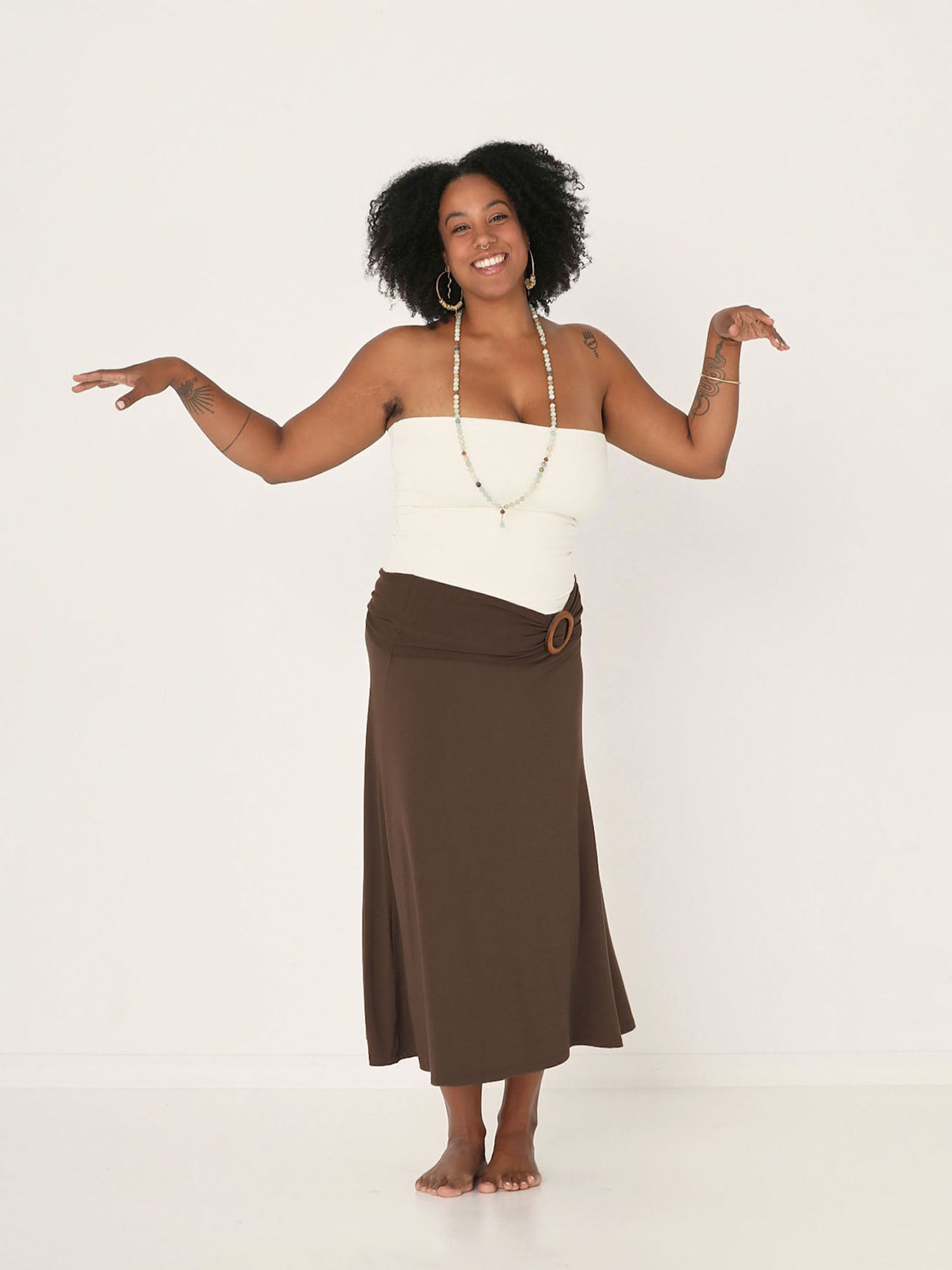Model wearing cream tube top with cocoa swing style long swishy skirt, mid - low calf length, double layered deep waistband, women's bamboo clothing