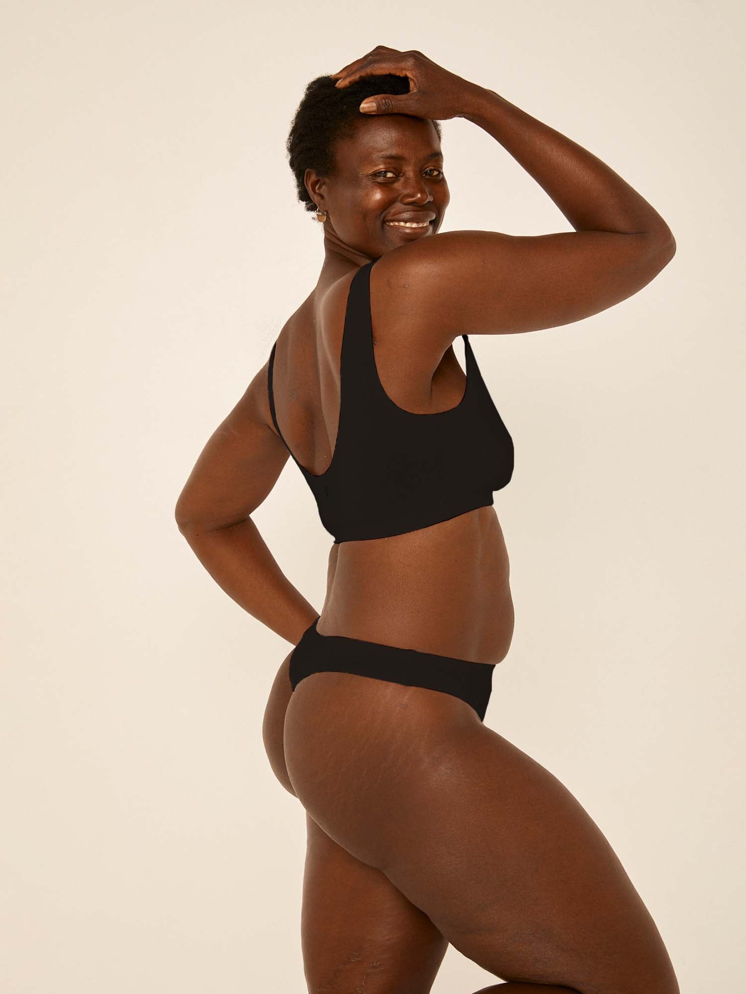 model wearing black hip g-string, mid waist, thong back, fuller coverage g-string, women's bamboo underwear