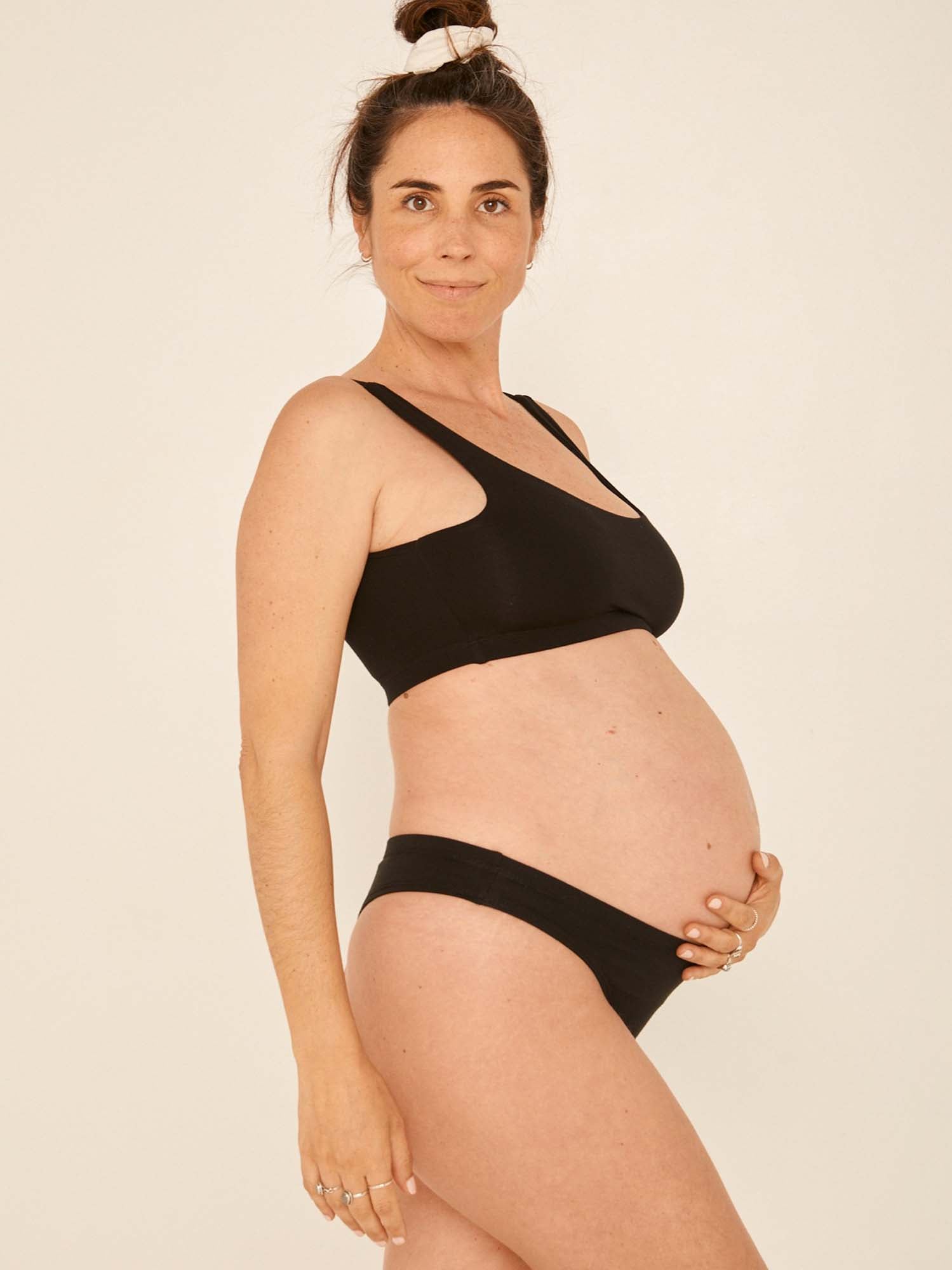 model wearing black hip g-string, mid waist, thong back, fuller coverage g-string, women's bamboo underwear