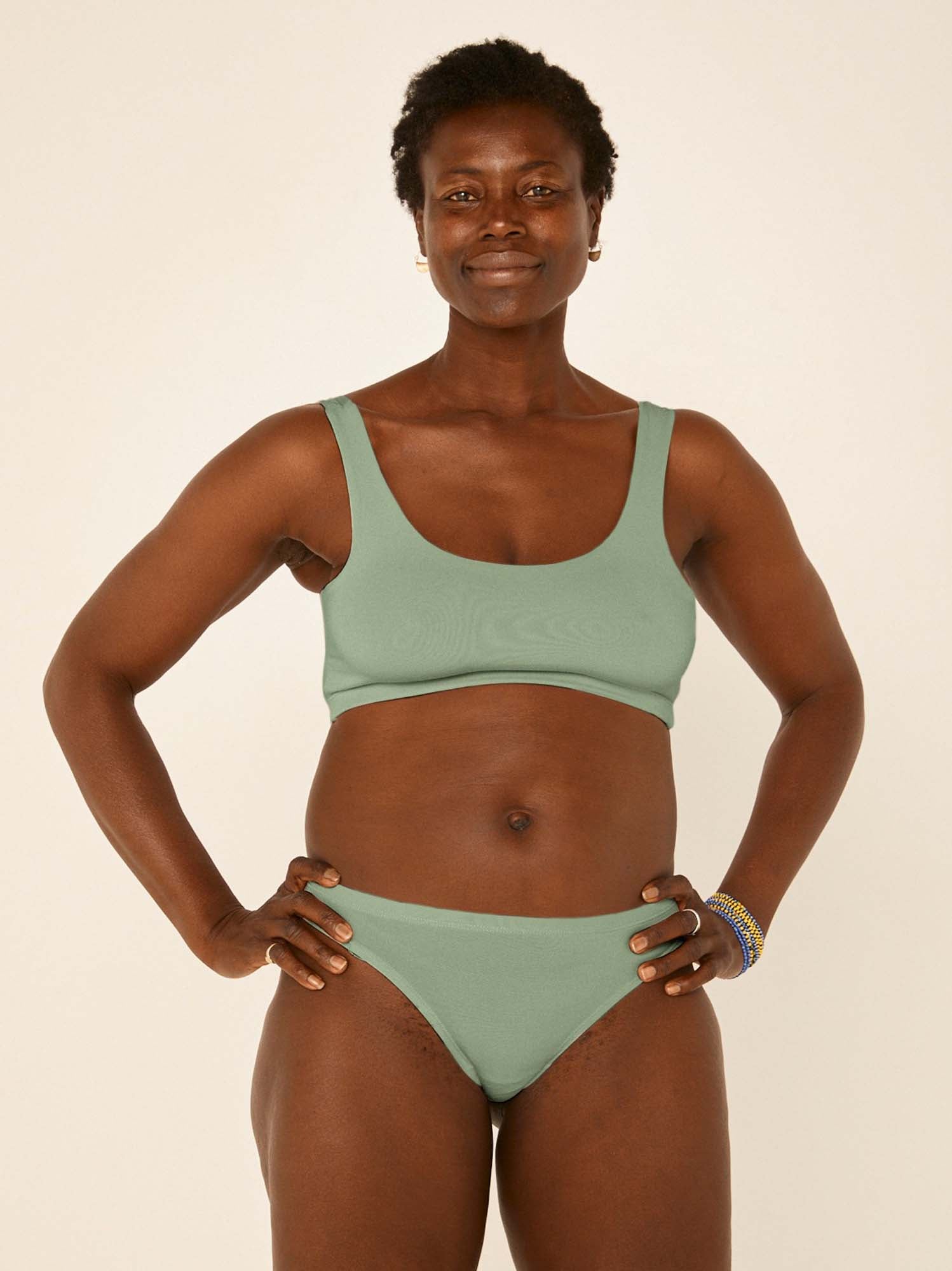 model wearing eucalyptus green hip g-string, mid waist, thong back, fuller coverage g-string, women's bamboo underwear