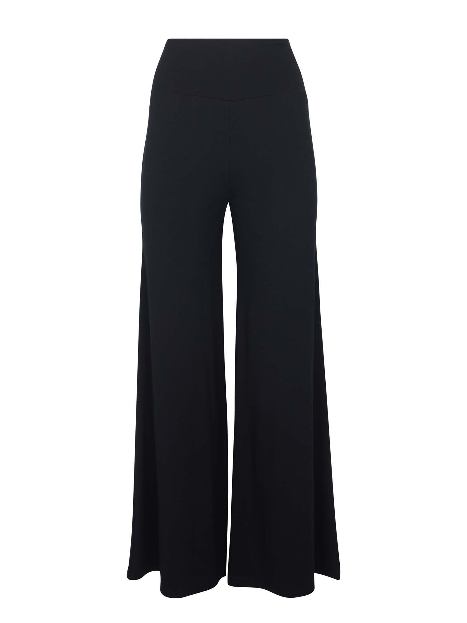 Model wearing black full length palazzo pants, fitted waist and hips with flowing wide leg, adjustible high waistband, women's bamboo clothing