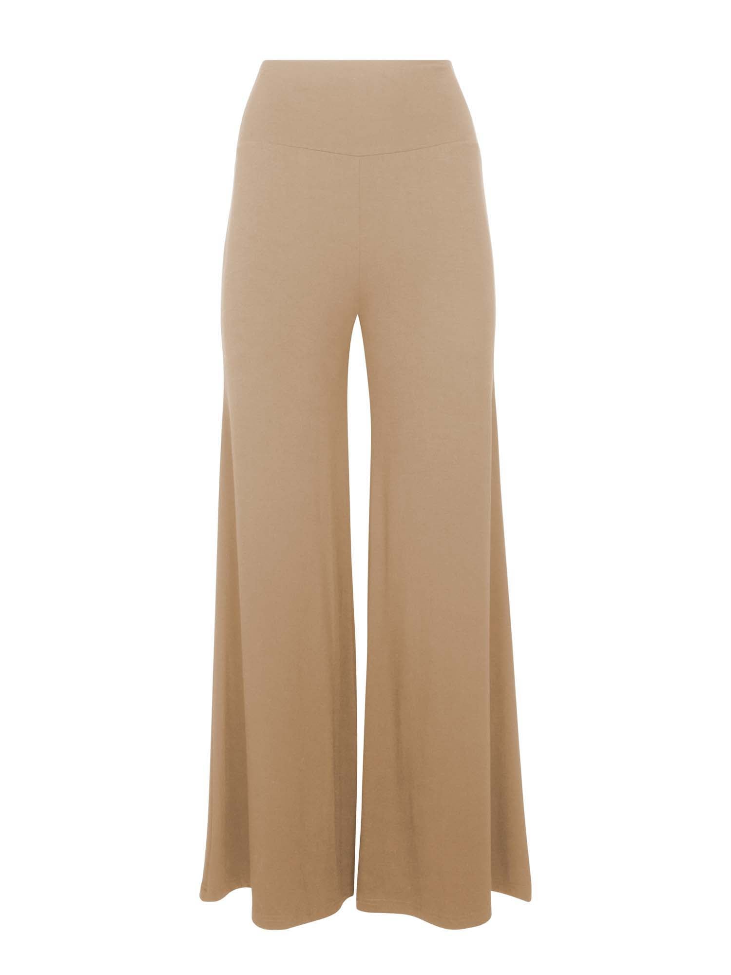 Model wearing caramel full length palazzo pants, fitted waist and hips with flowing wide leg, adjustible high waistband, women's bamboo clothing