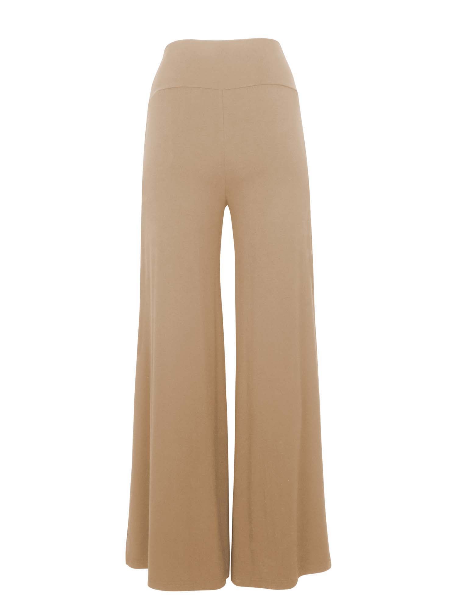 Model wearing caramel full length palazzo pants, fitted waist and hips with flowing wide leg, adjustible high waistband, women's bamboo clothing