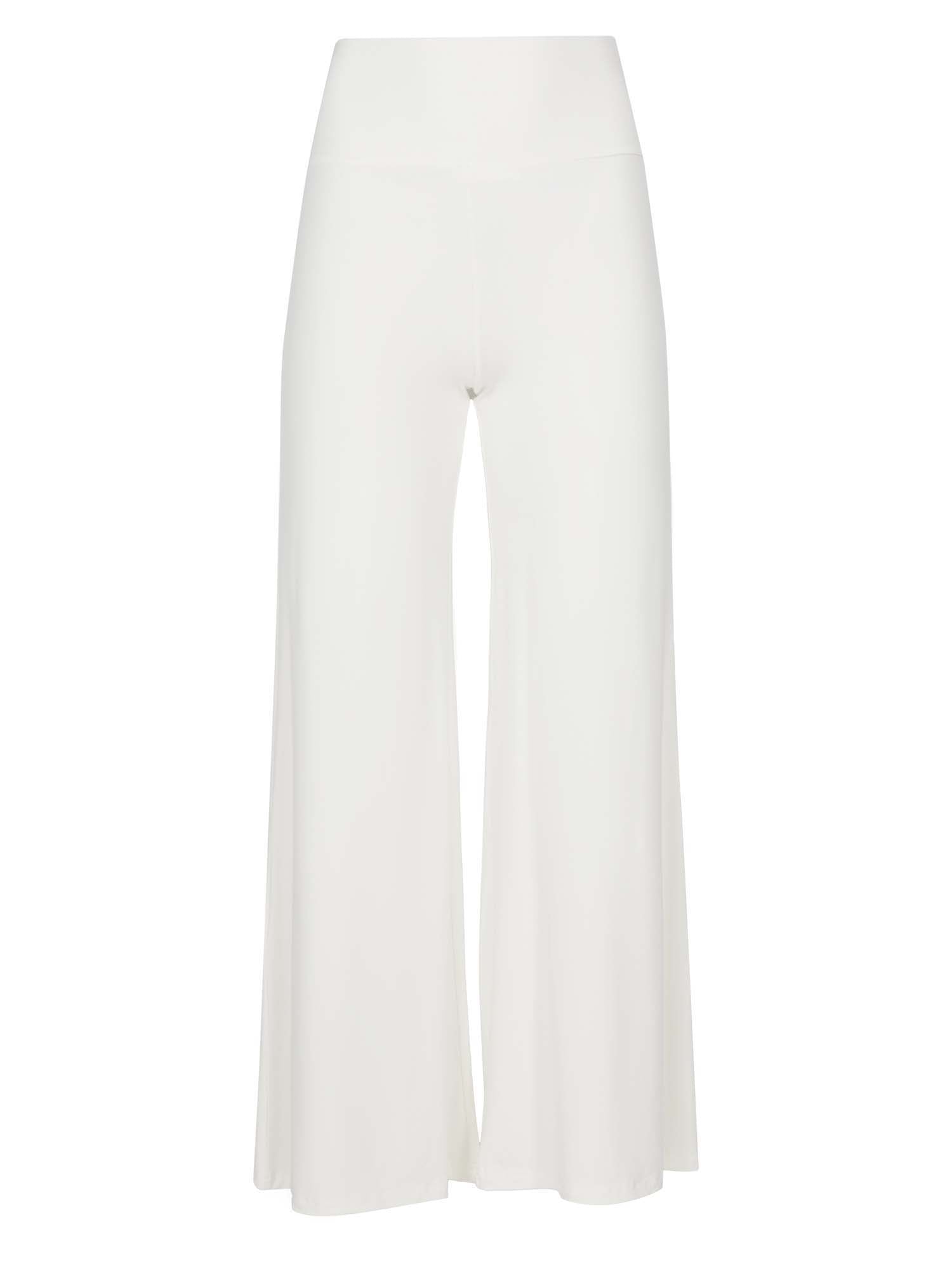 Model wearing cream full length palazzo pants, fitted waist and hips with flowing wide leg, adjustible high waistband, women's bamboo clothing