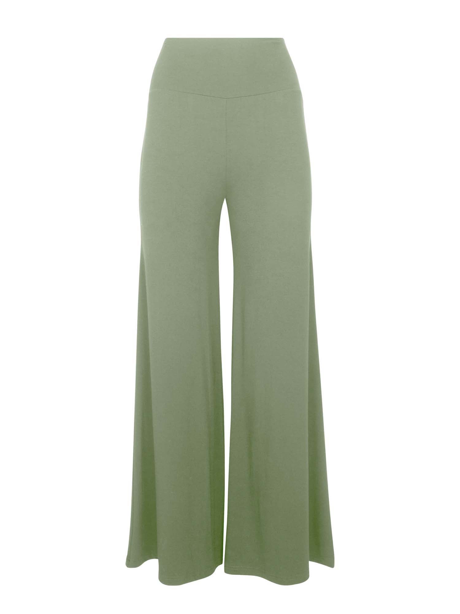 Model wearing eucalyptus full length palazzo pants, fitted waist and hips with flowing wide leg, adjustible high waistband, women's bamboo clothing