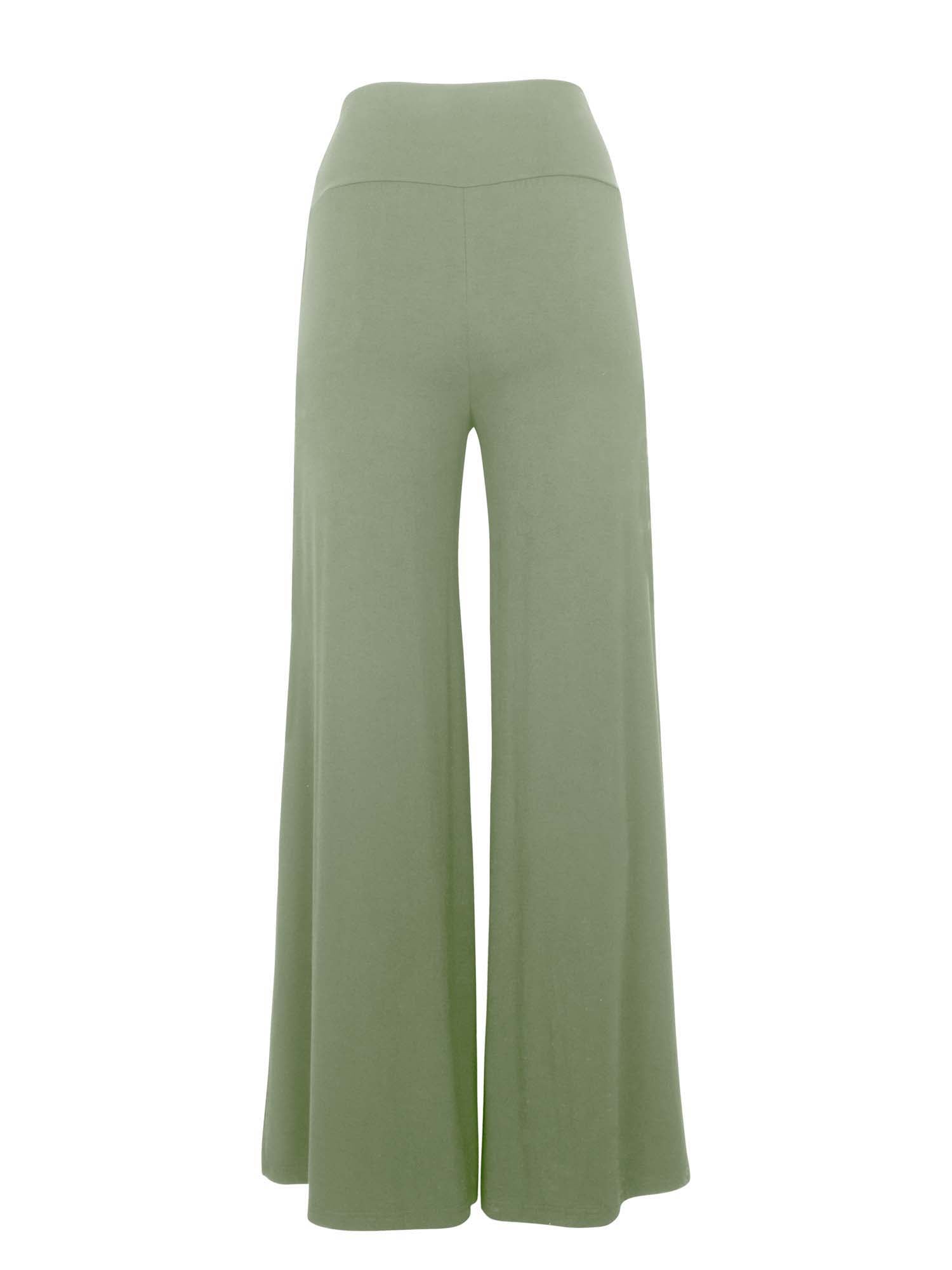 Model wearing eucalyptus full length palazzo pants, fitted waist and hips with flowing wide leg, adjustible high waistband, women's bamboo clothing