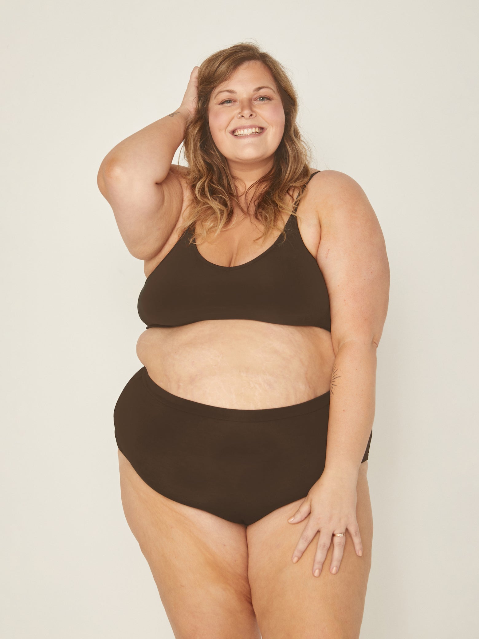 Model wearing a cocoa wireless yoga bra, subtle v front, soft cup bralette with adjustable camisole straps, women's bamboo underwear