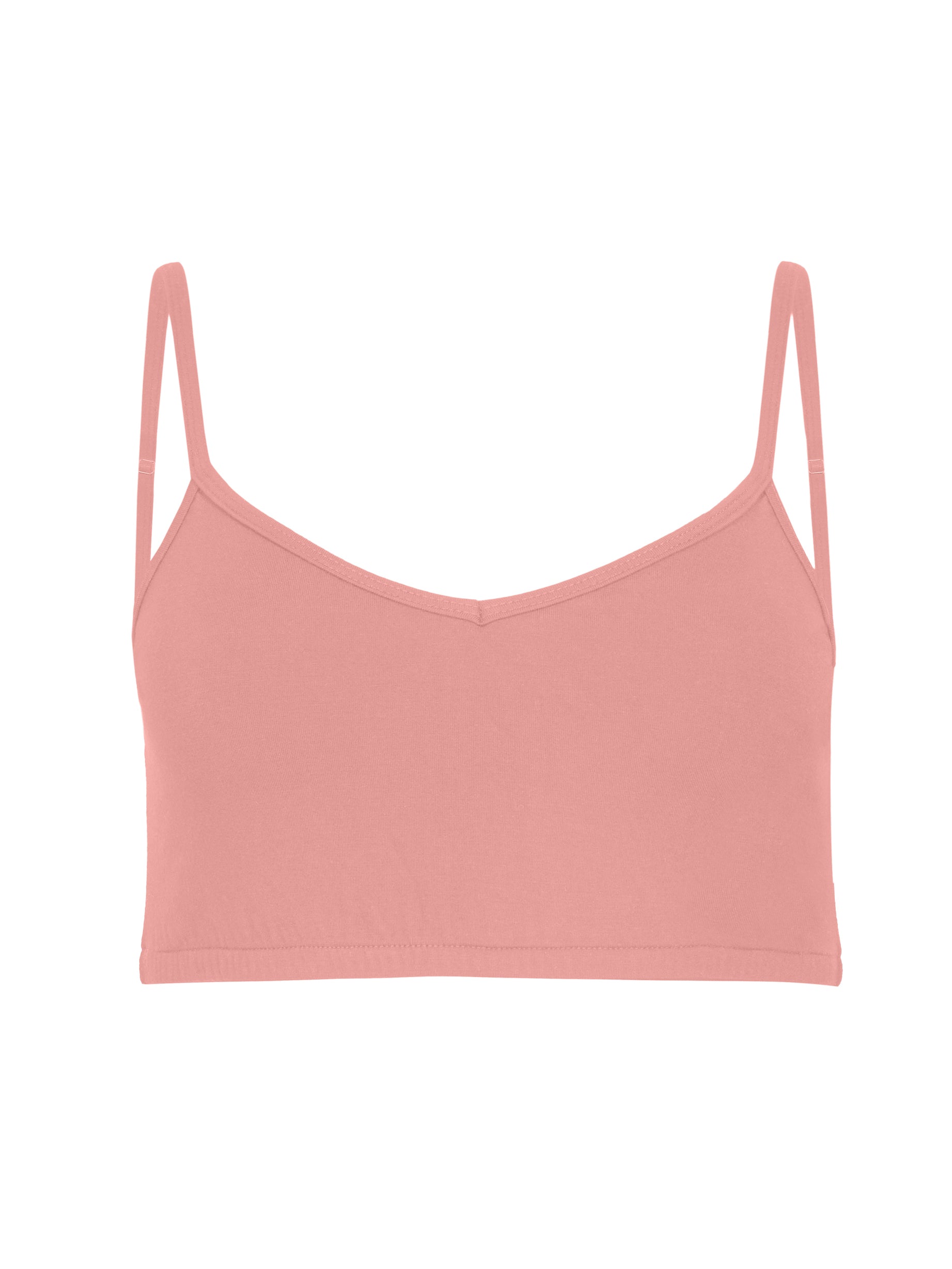Model wearing a pink, wireless yoga bra, subtle v front, soft cup bralette with adjustable camisole straps, women's bamboo underwear