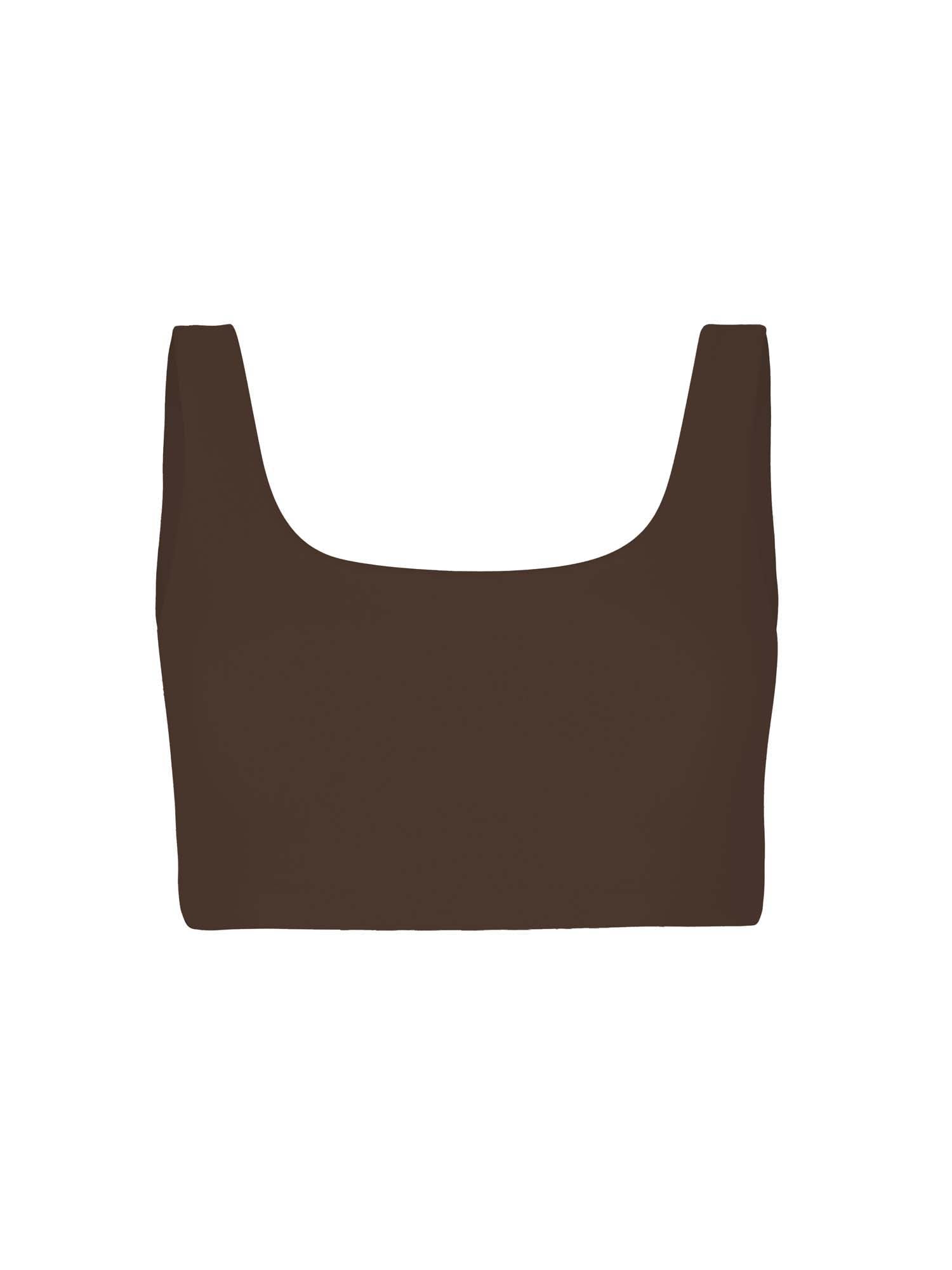 Model wearing cocoa reversible bra, high or low scoop neckline and wide shoulder straps, wireless bra, women's bamboo underwear