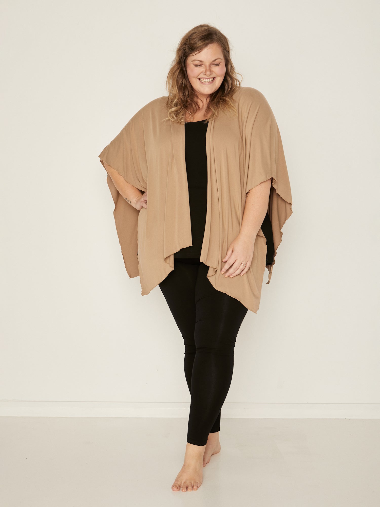 Model wearing caramel brown large shawl, nourishing wrap, women's bamboo clothing