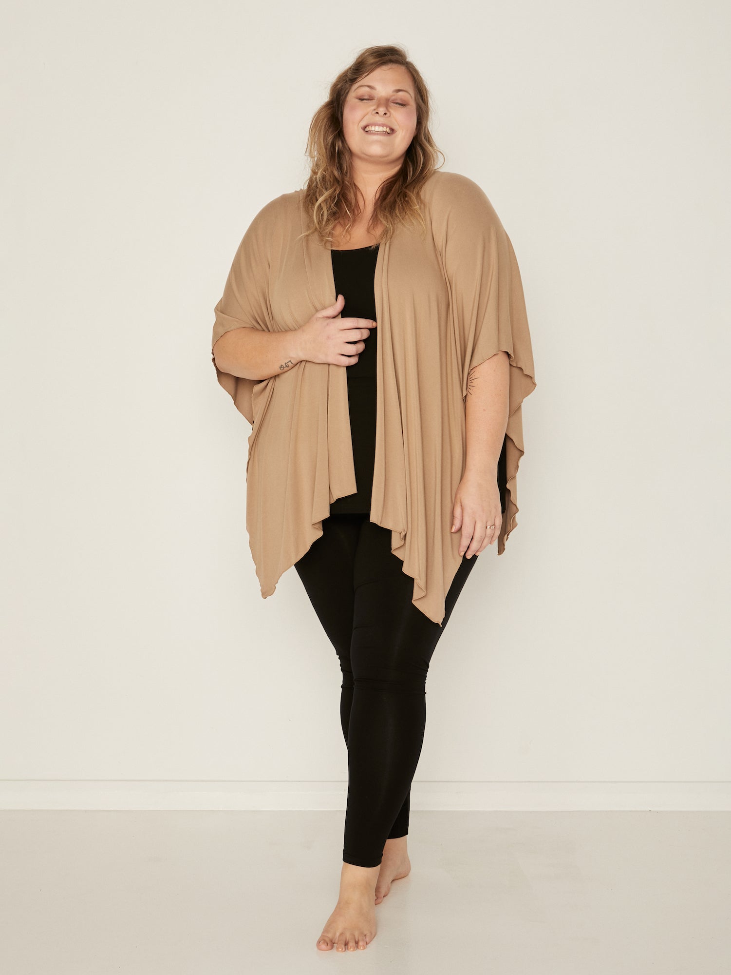 Model wearing caramel brown large shawl, nourishing wrap, women's bamboo clothing