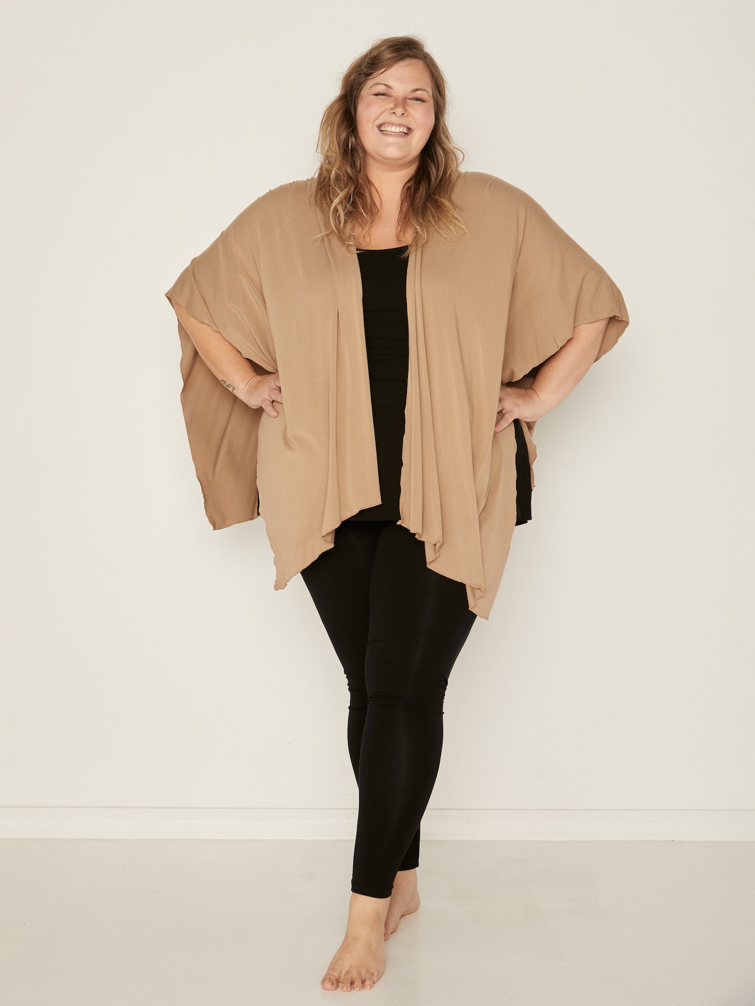Model wearing caramel brown large shawl, nourishing wrap, women's bamboo clothing
