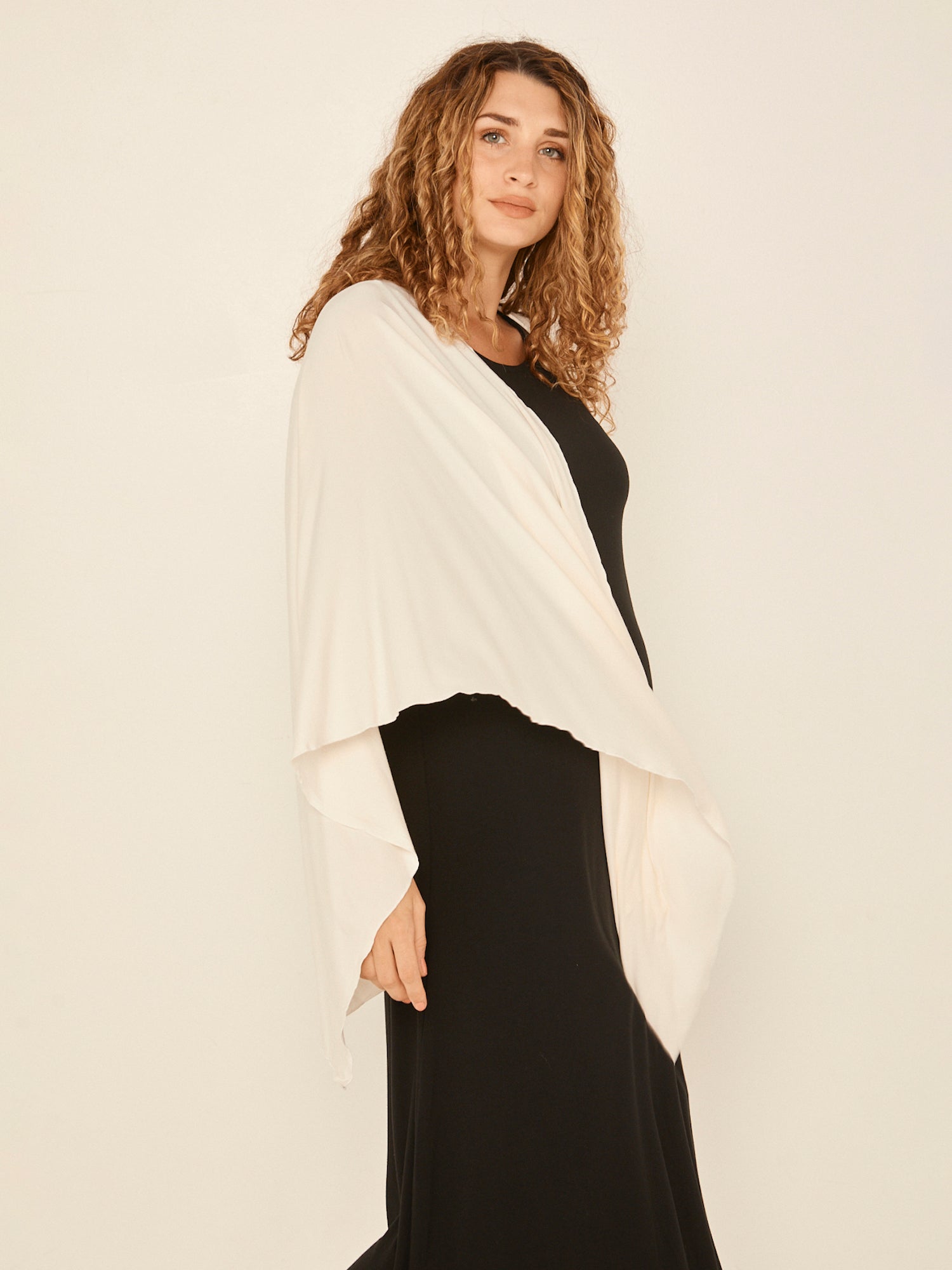 Model wearing cream large nourishing wrap, women's bamboo clothing